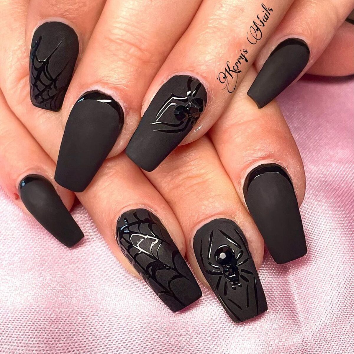 1. Matte Black Nails with Glossy Spiderweb Accents