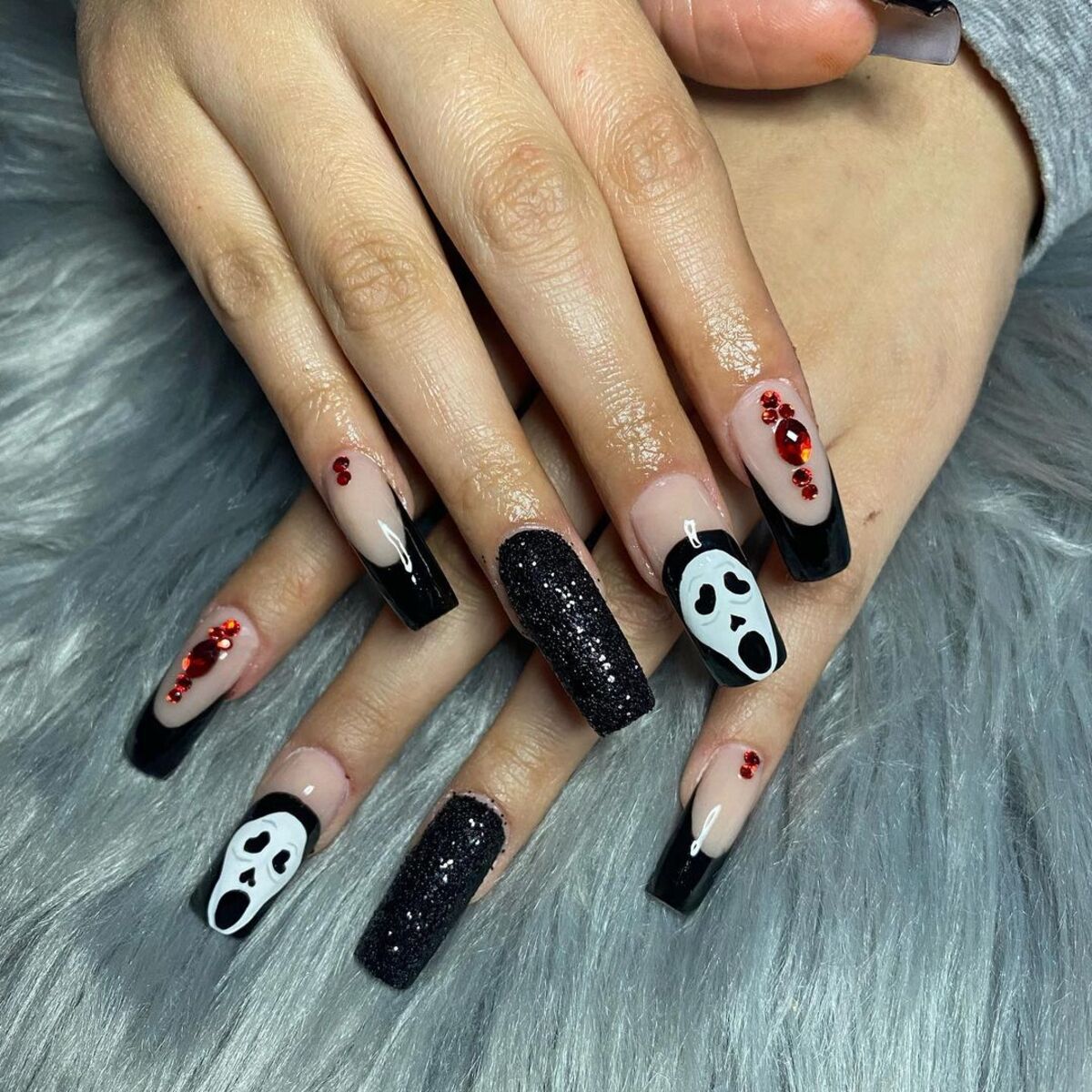 21. Scream-Inspired Nails with Glitter and Blood Accents