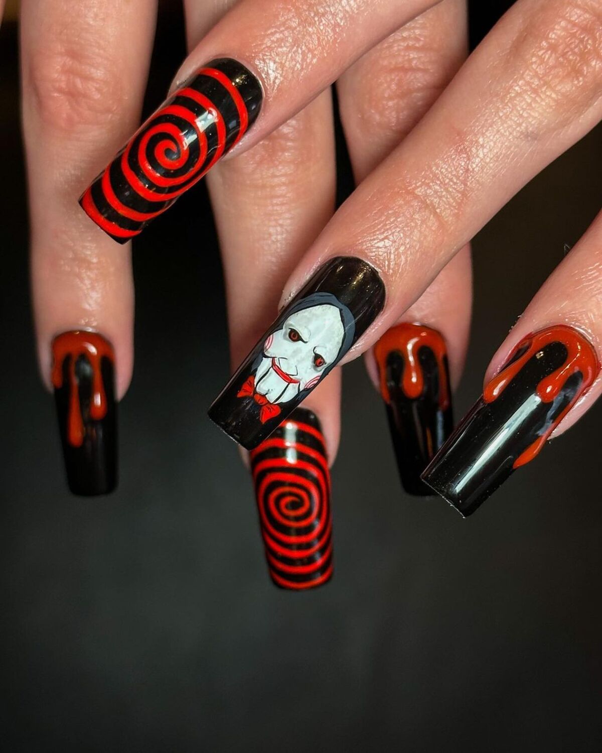 10. Sinister Saw-Inspired Nails with Dripping Blood Effects