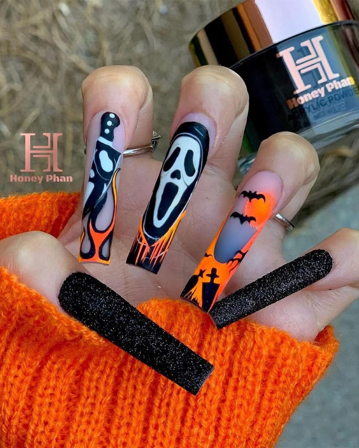 22. Scream-Inspired Nails with Fiery Details