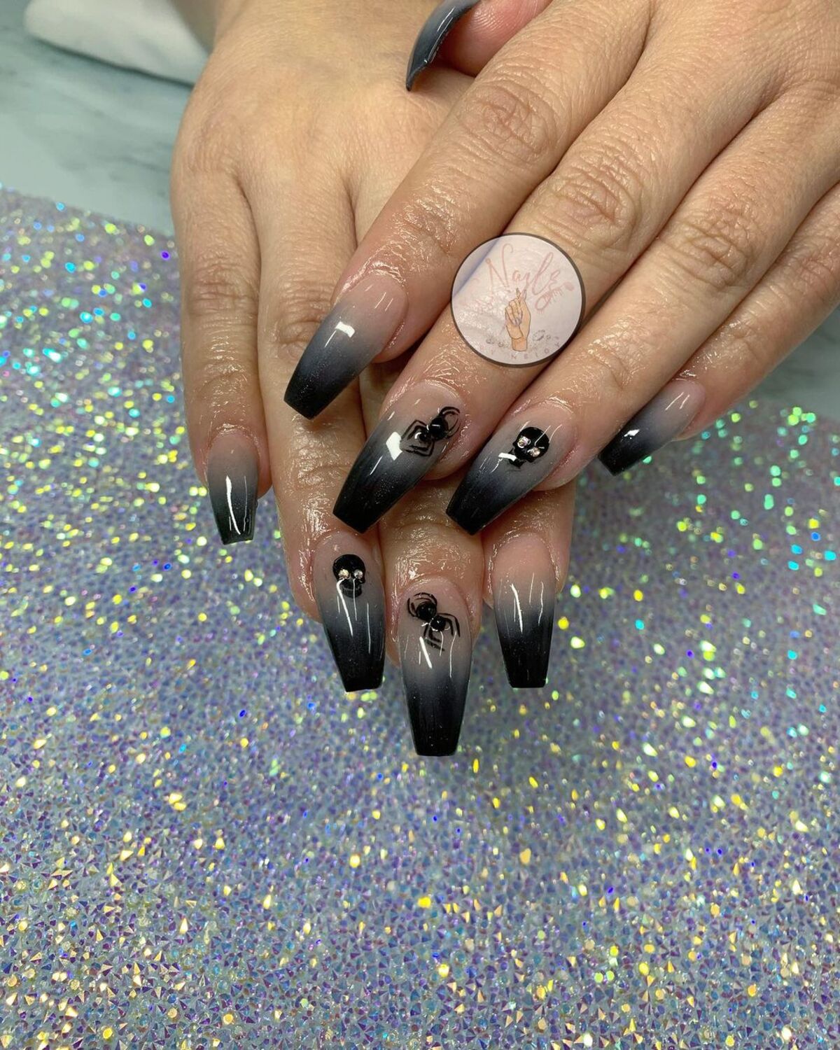 28. Ombre Black Nails with Subtle Spider Accents