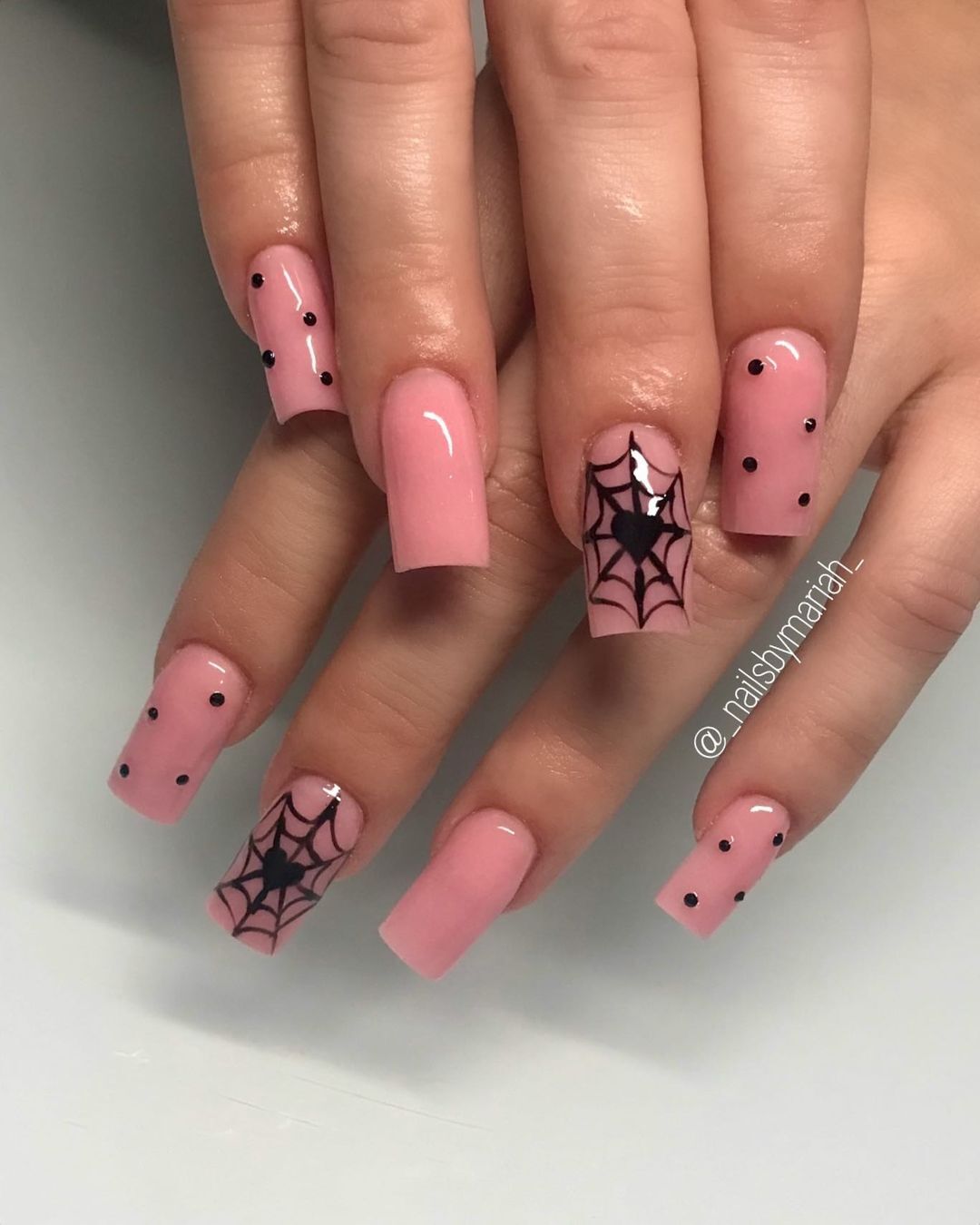 3. Soft Pink Nails with Delicate Spiderweb Details