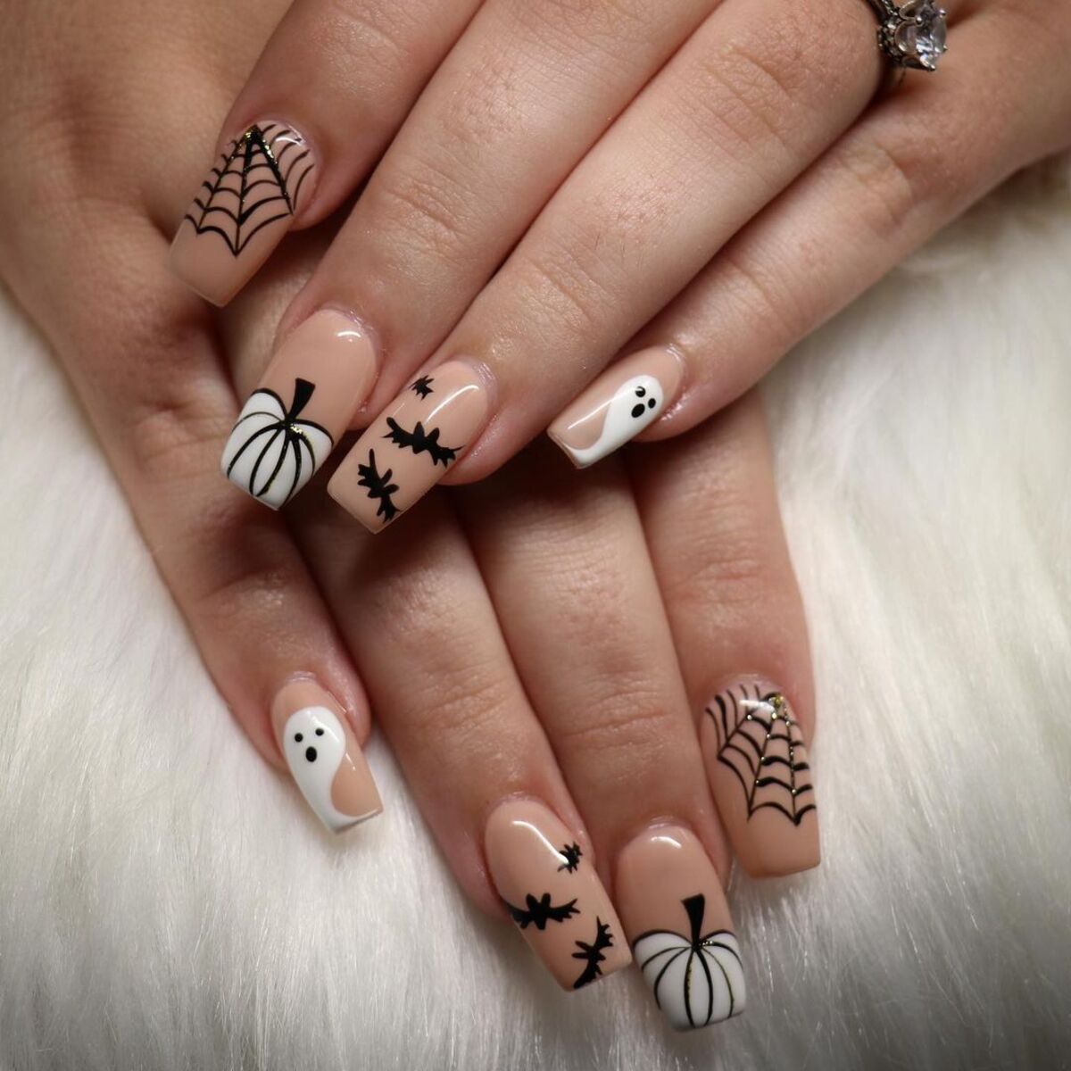 8. Classic Halloween Icons on Nude Nails