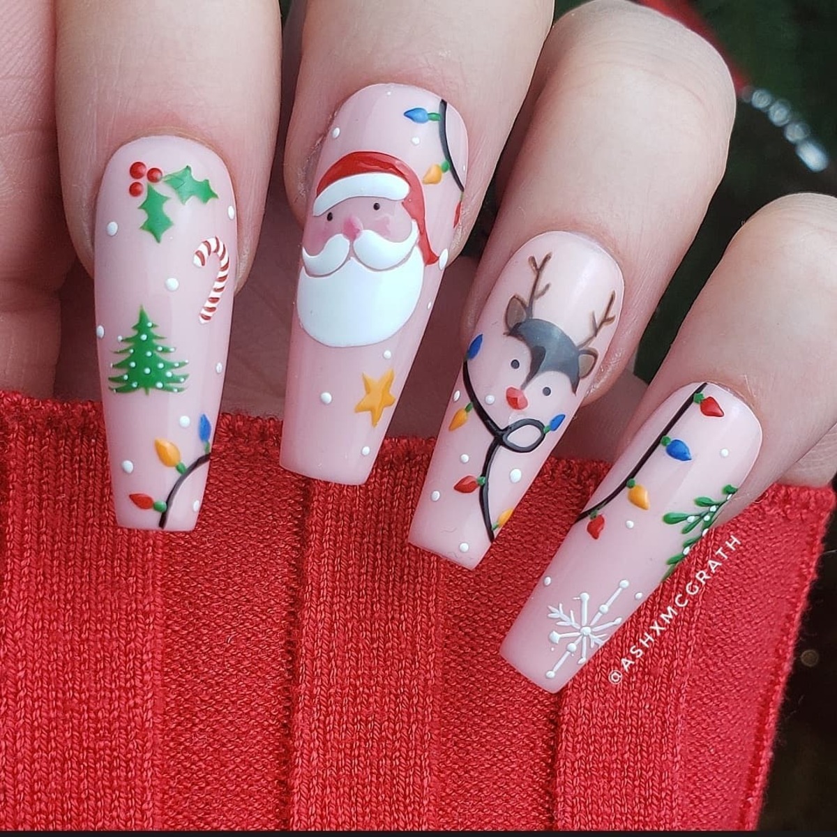 22. Santa and Reindeer Fun on Nude Nails