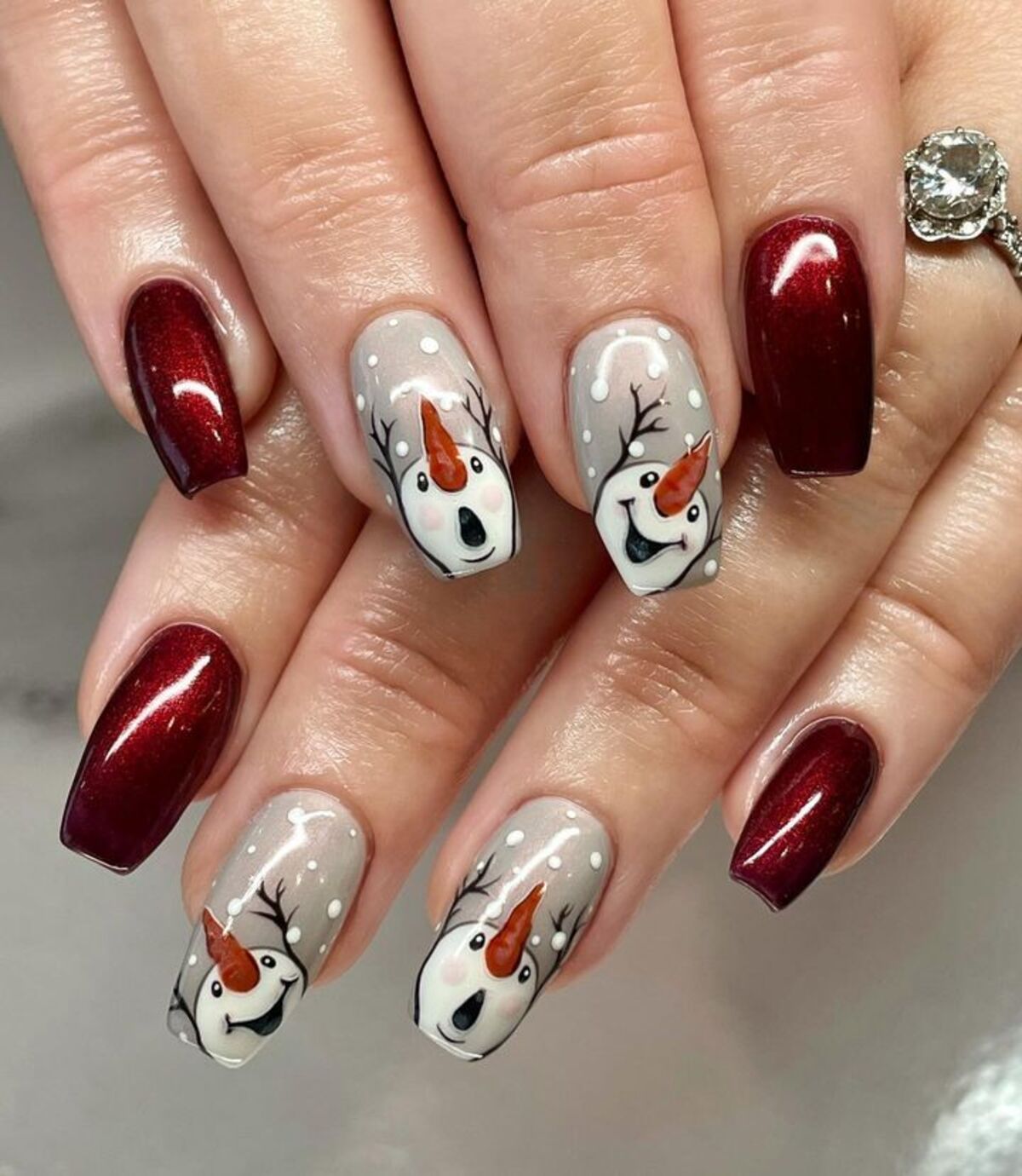 25. Playful Snowman and Rich Burgundy Nails