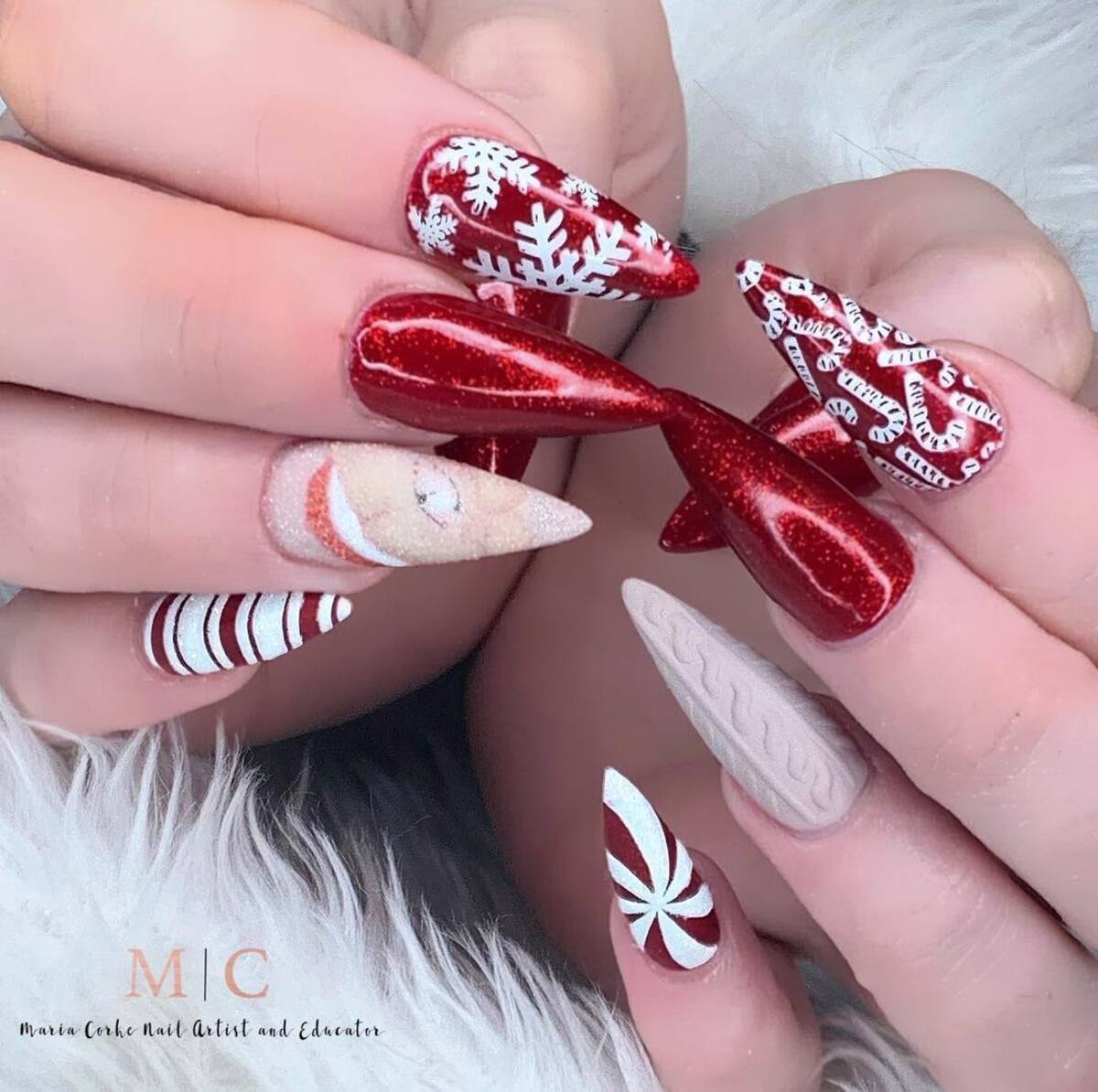 6. Santa’s Cheerful Crew on Stiletto Nails