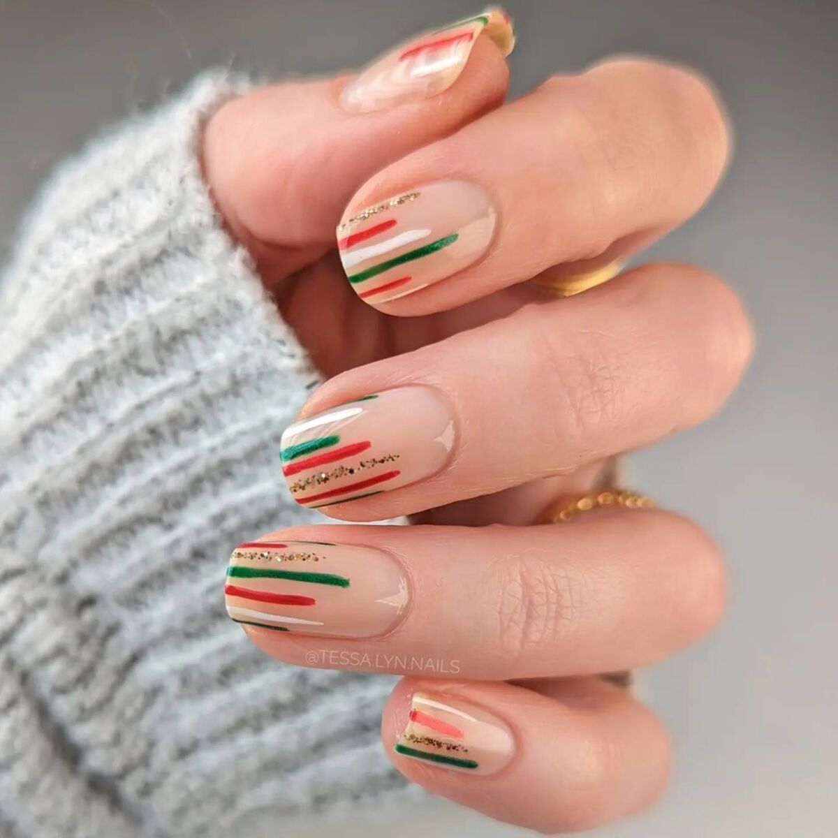 26. Subtle Striped Accents on Nude Nails