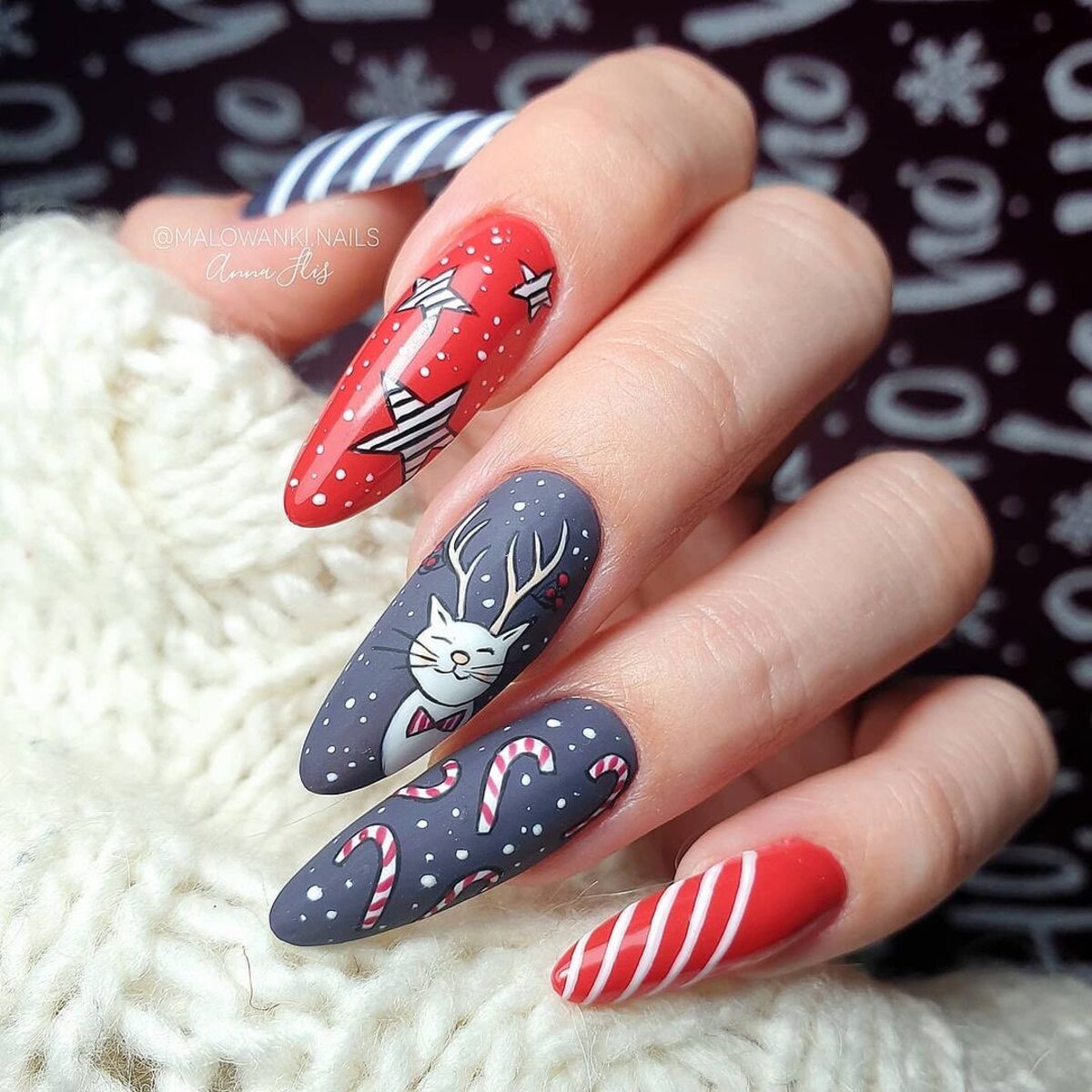 14. Cute Reindeer and Candy Cane Nails