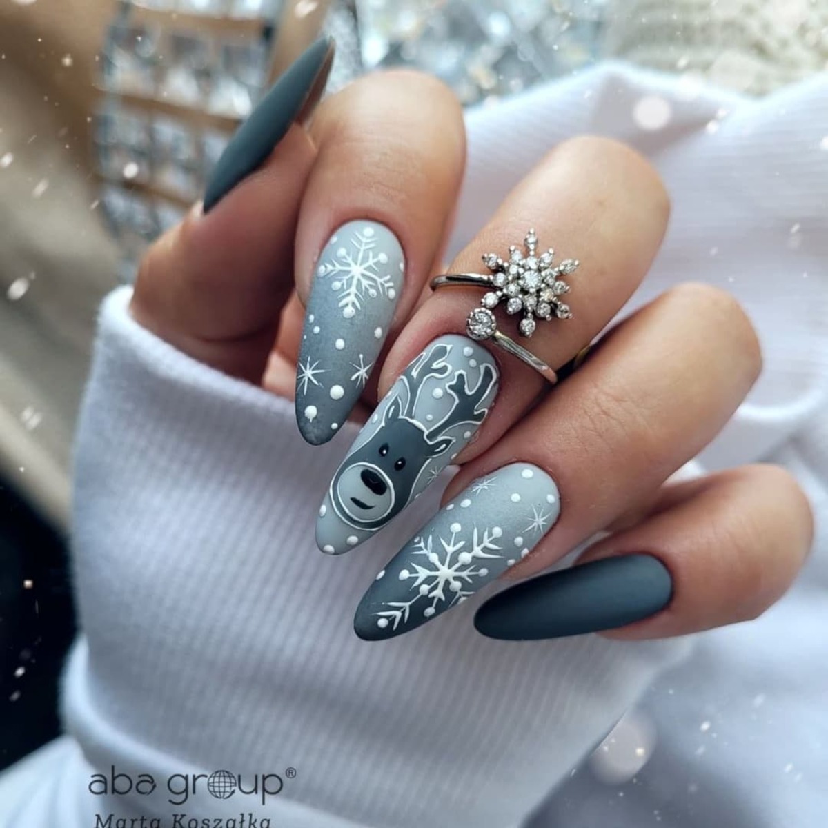 16. Frosty Reindeer and Snowflake Nails