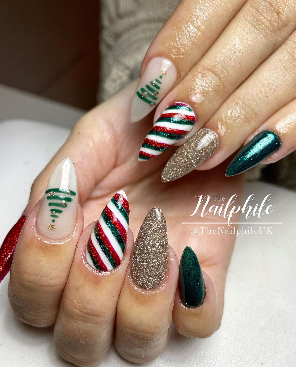 4. Glittering Stripes and Christmas Tree Design on Almond Nails