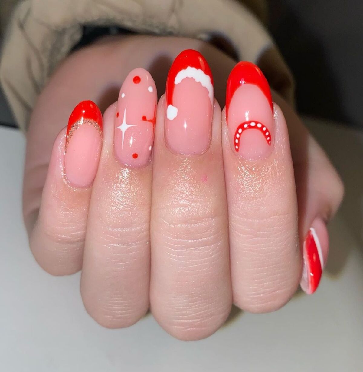 8. Playful Red and Pink Santa-Inspired Nails