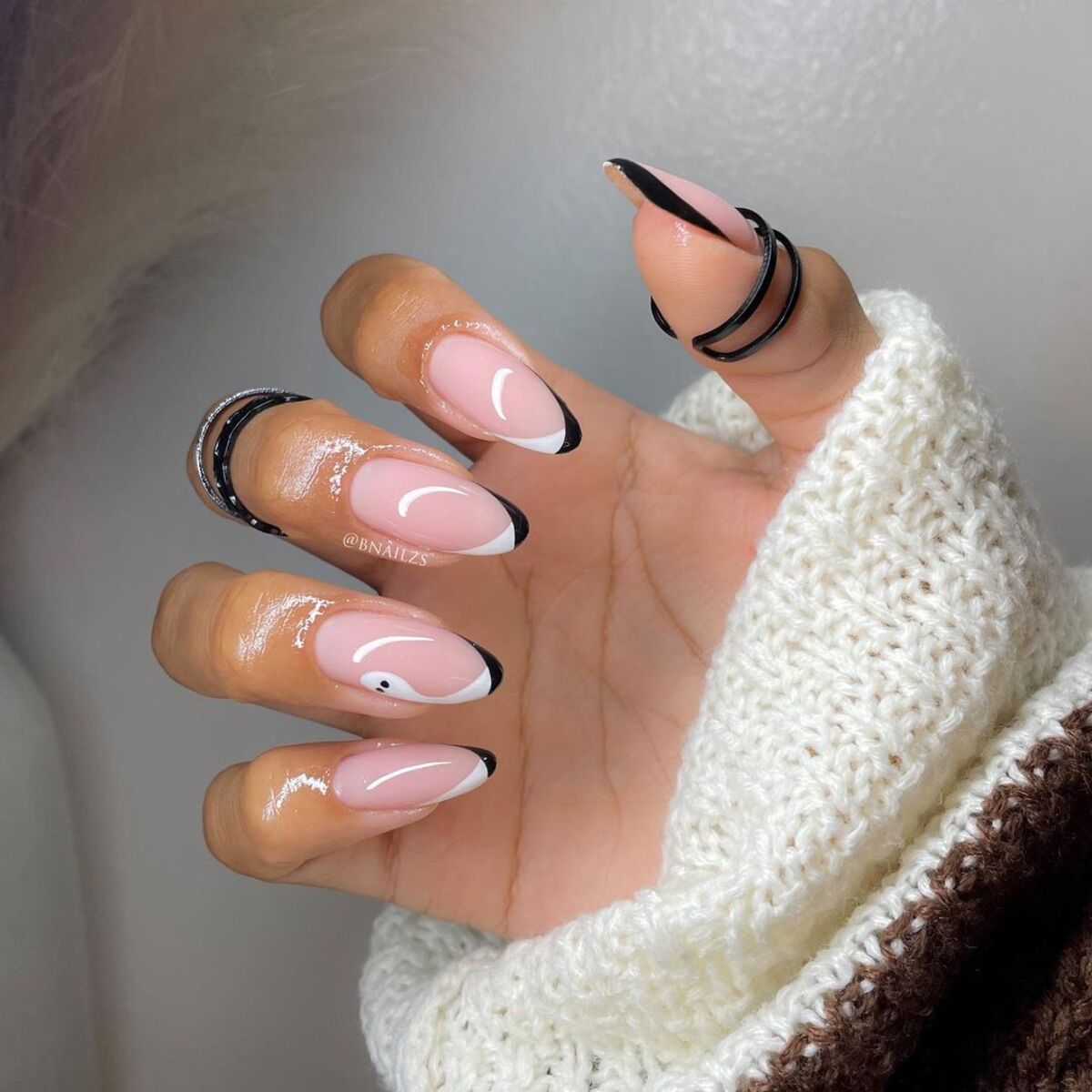 11. Modern Black French Tips with a Twist