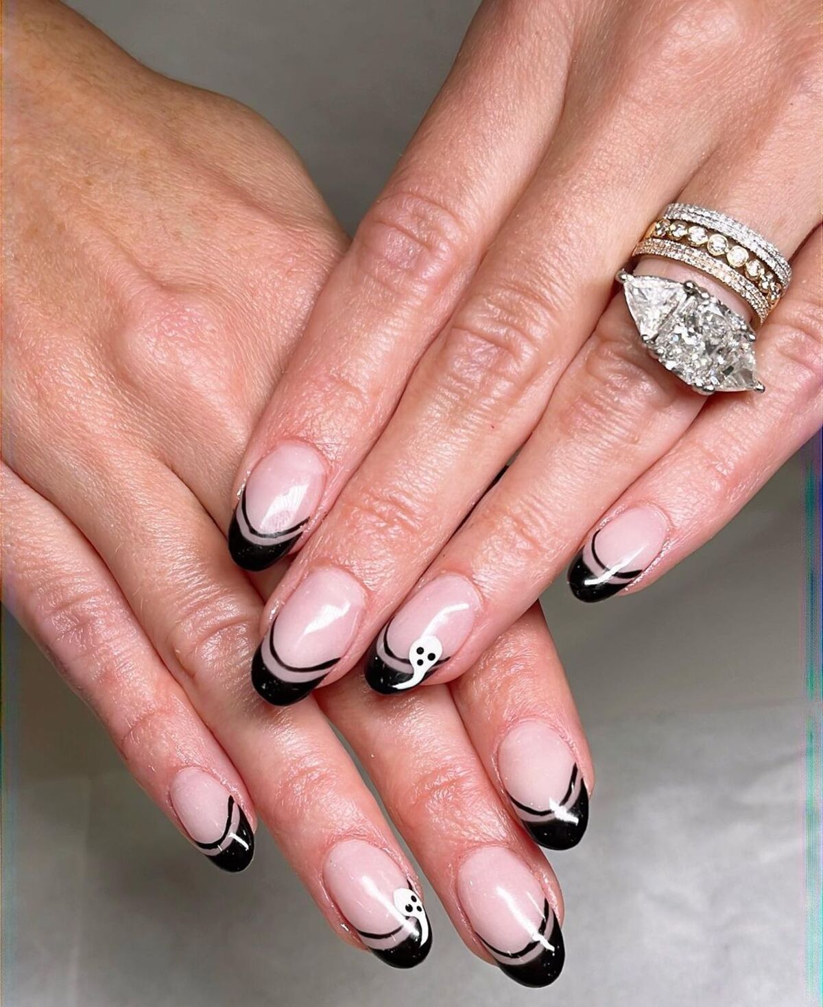 17. Chic Black French Tips with Ghosts