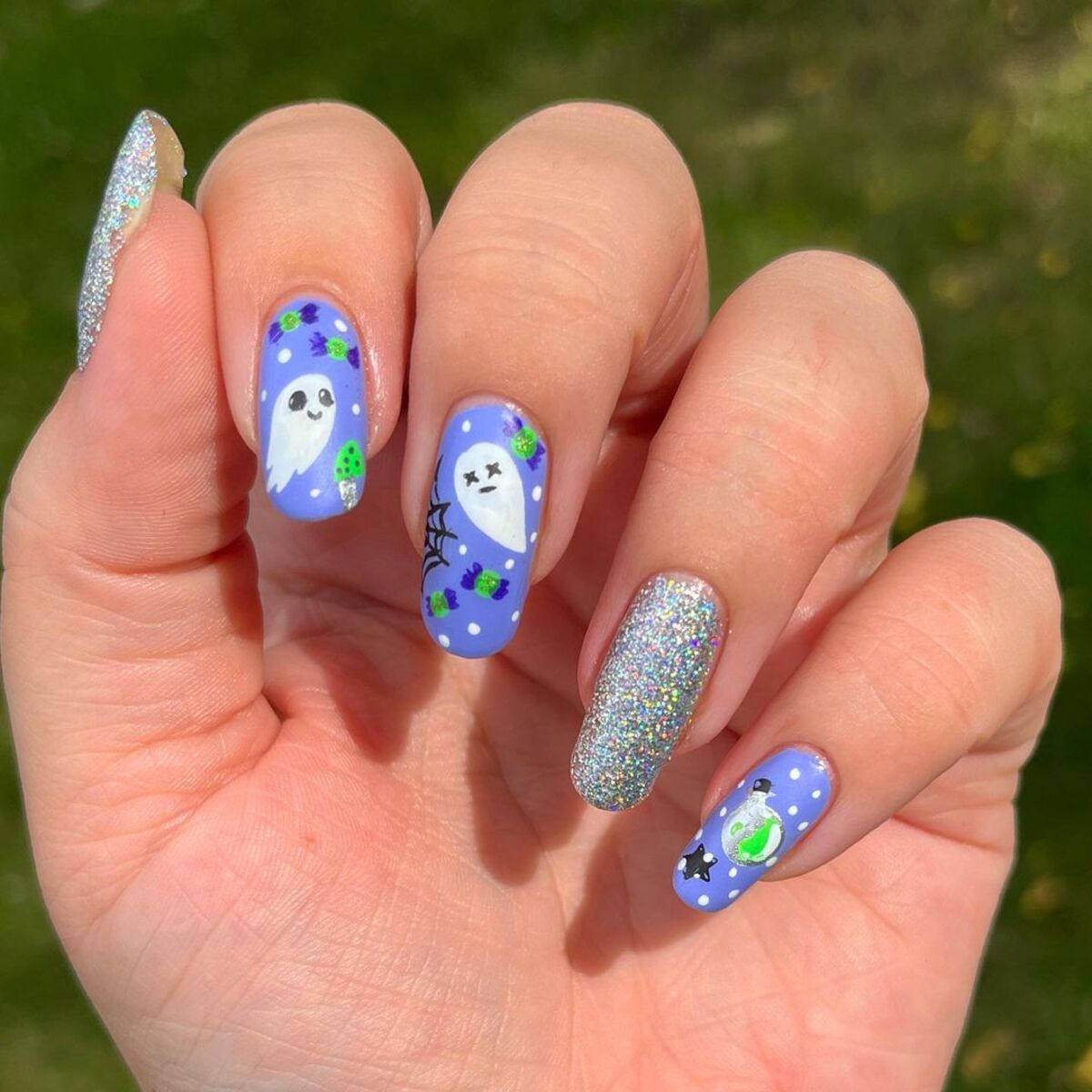 10. Vibrant Ghost and Bat Nail Art