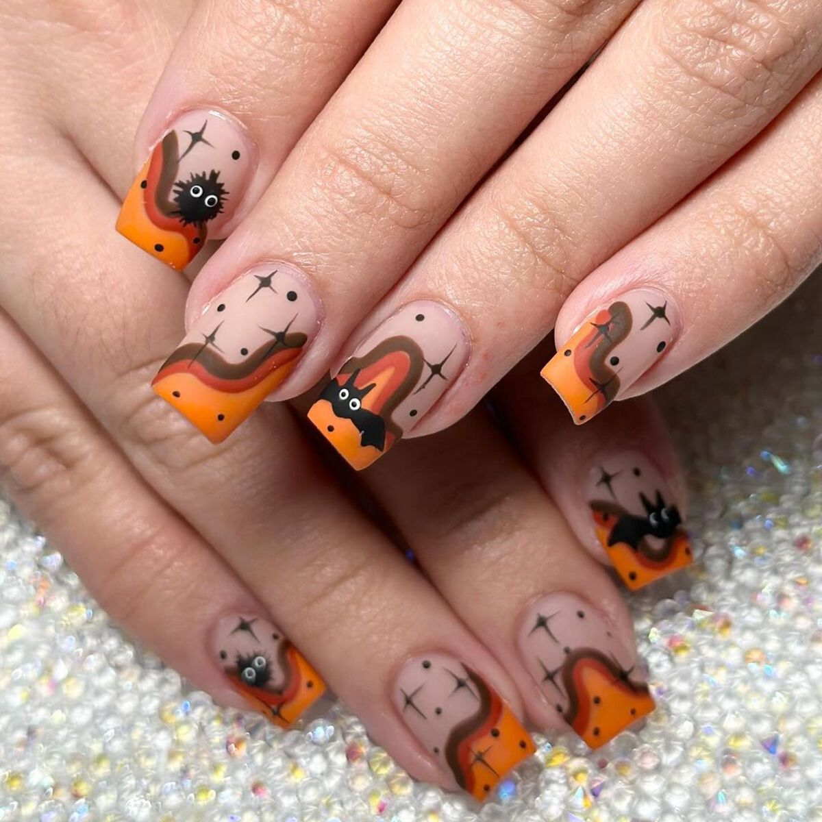 21. Spooky French Tips with Bats and Spiders