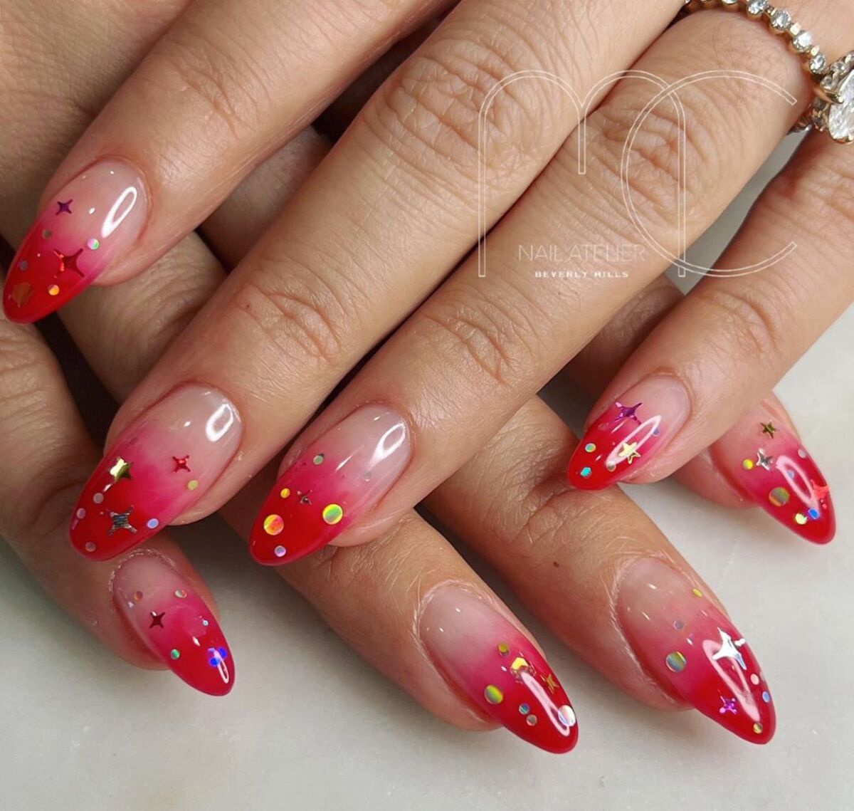 23. Festive Red Ombre with Holographic Confetti