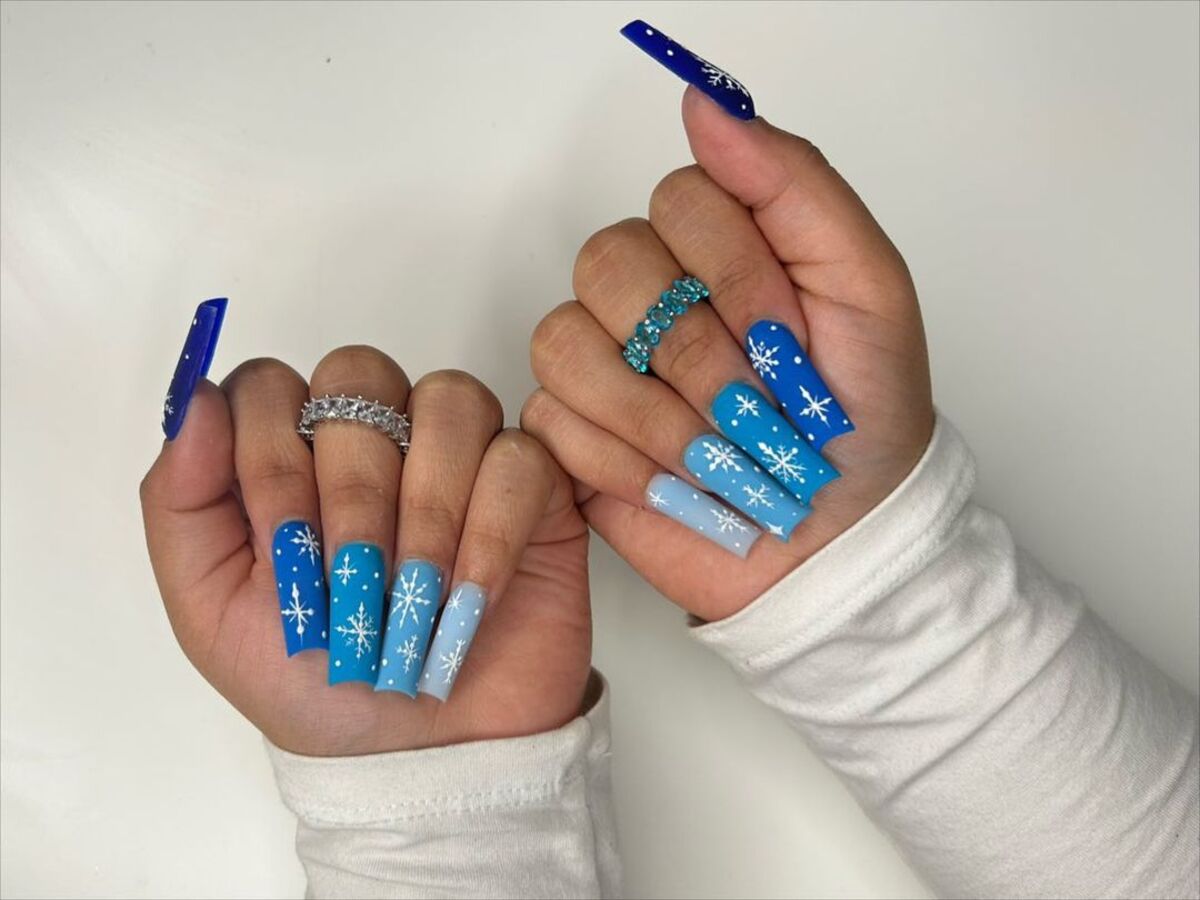 13. Elegant Blue French Tips with Snowflake Accents