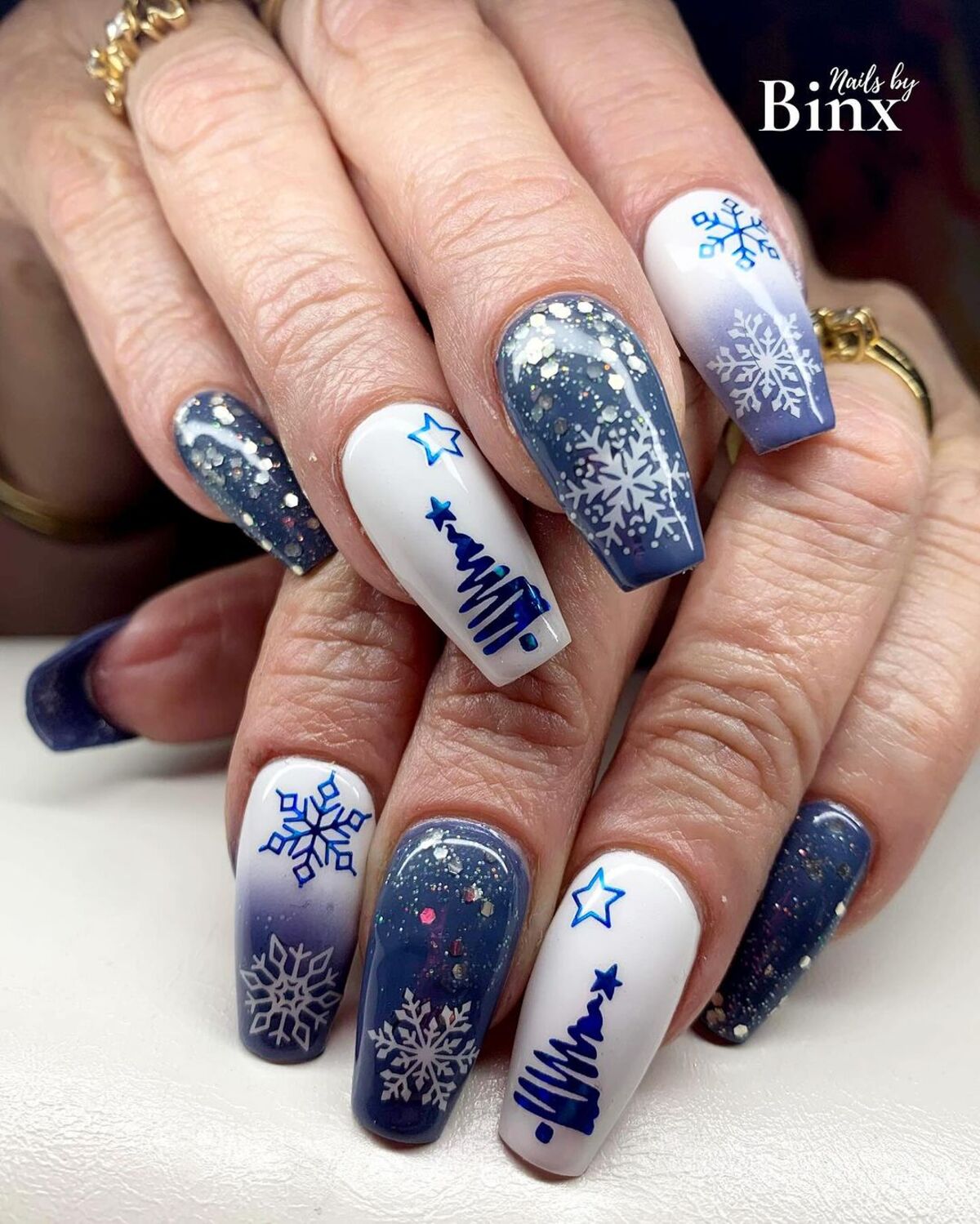 14. Frosty Ombre Blue Snowflake Nails