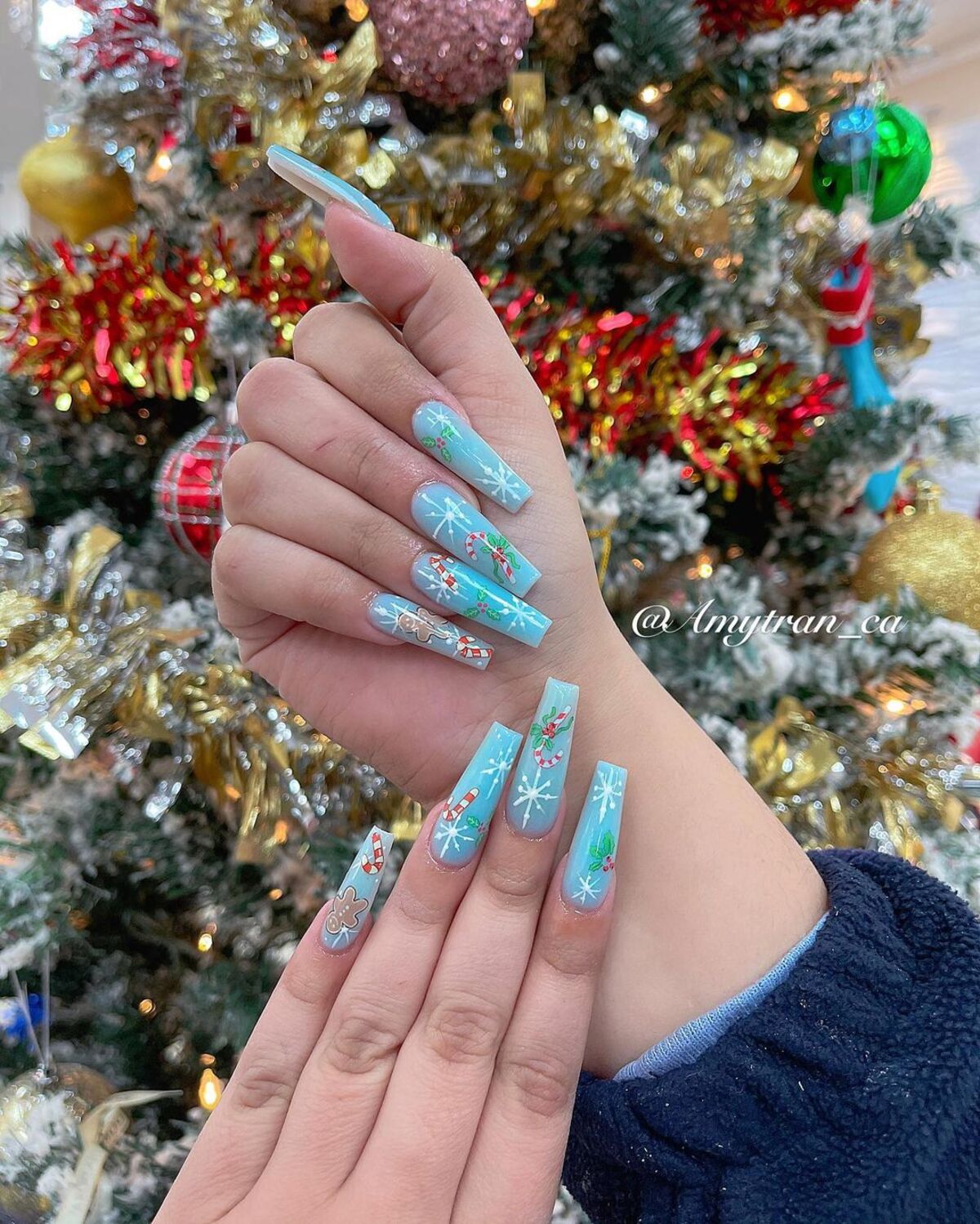 25. Light Blue Christmas Nail Art with Gingerbread Accents