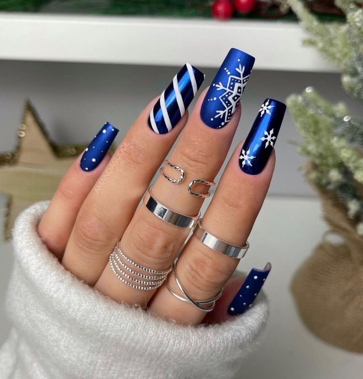 30. Royal Blue Nails with Snowflakes and Stripes