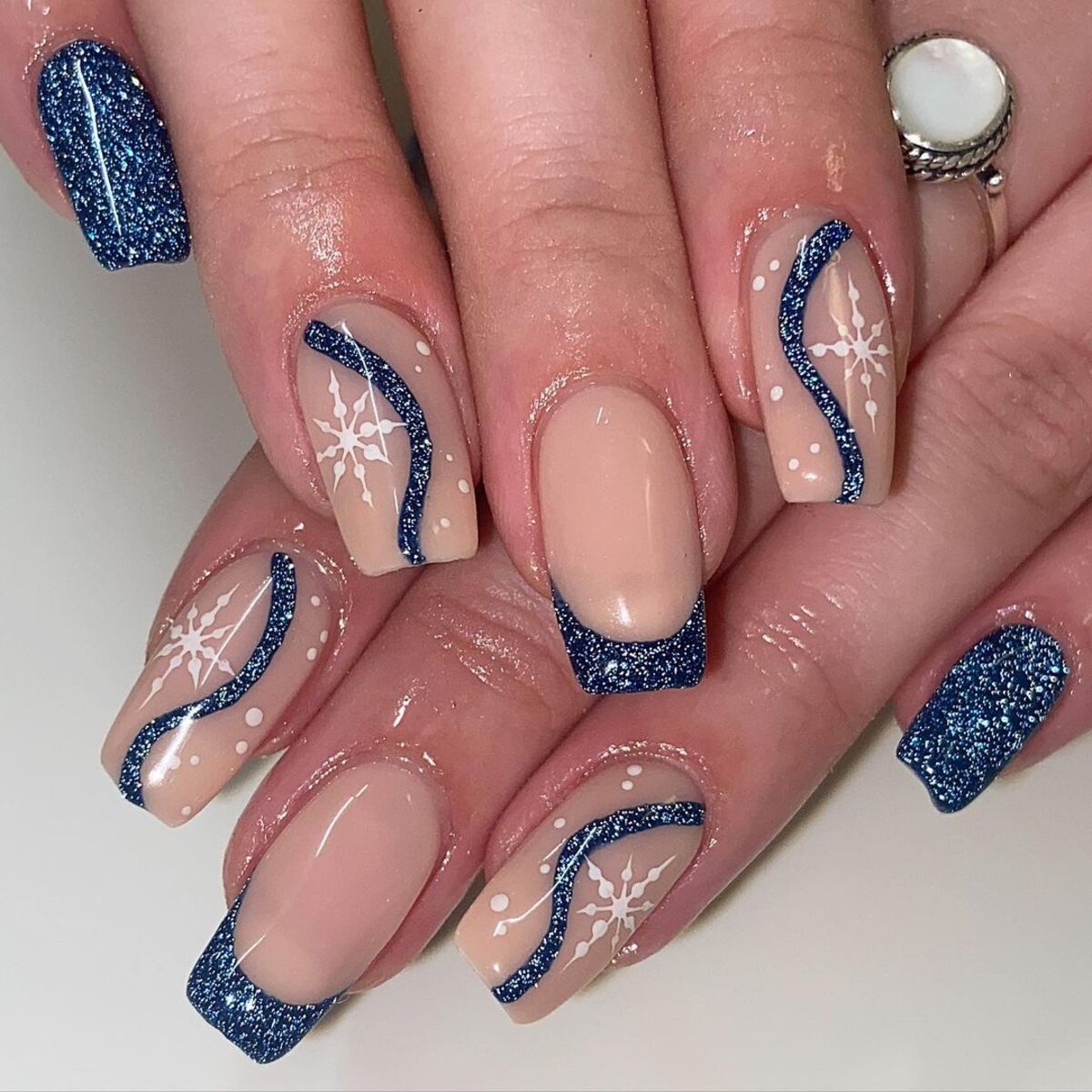 9. Nude and Navy French Tips with Snowflakes