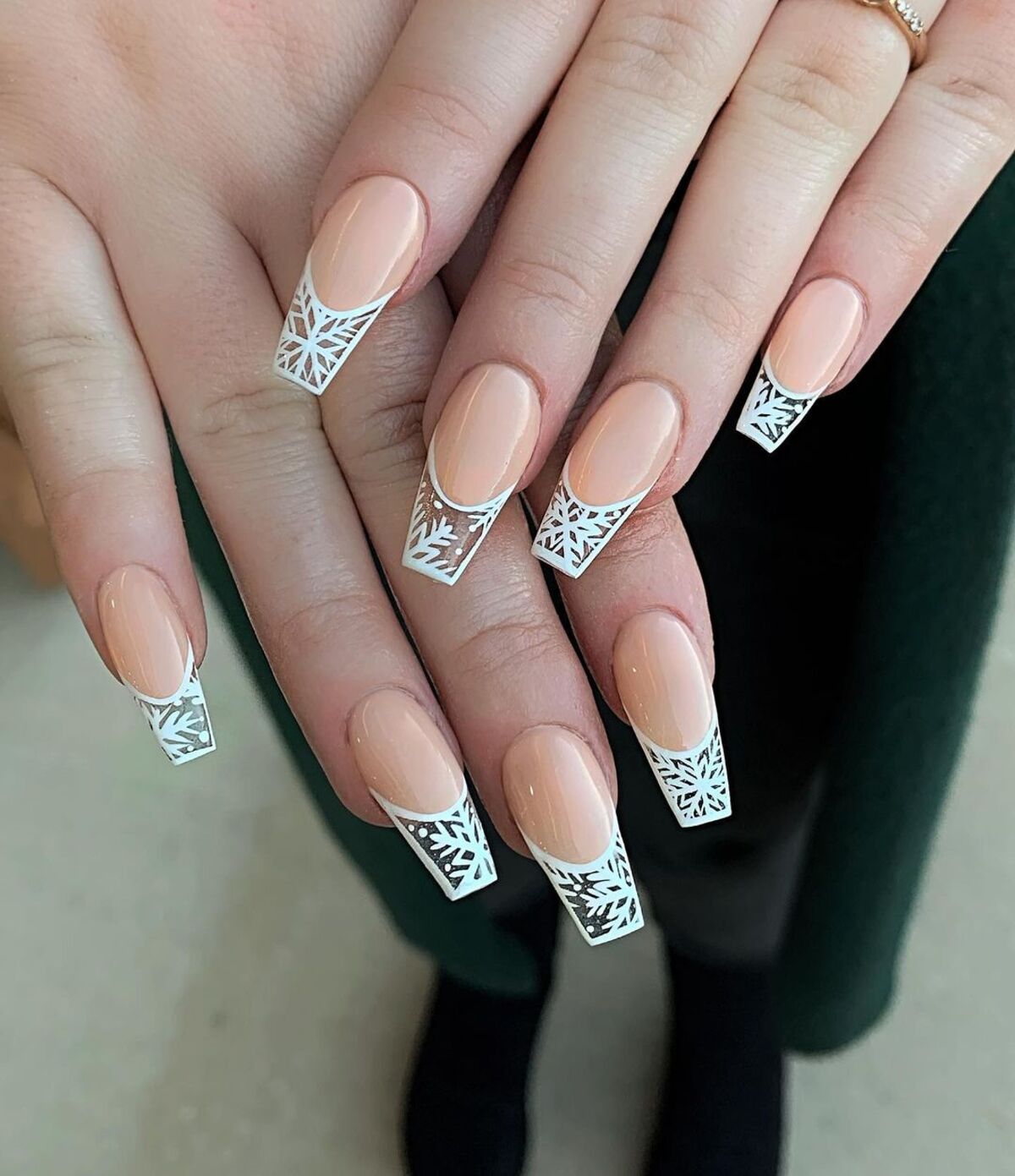 20. Snowflake-Patterned French Tips