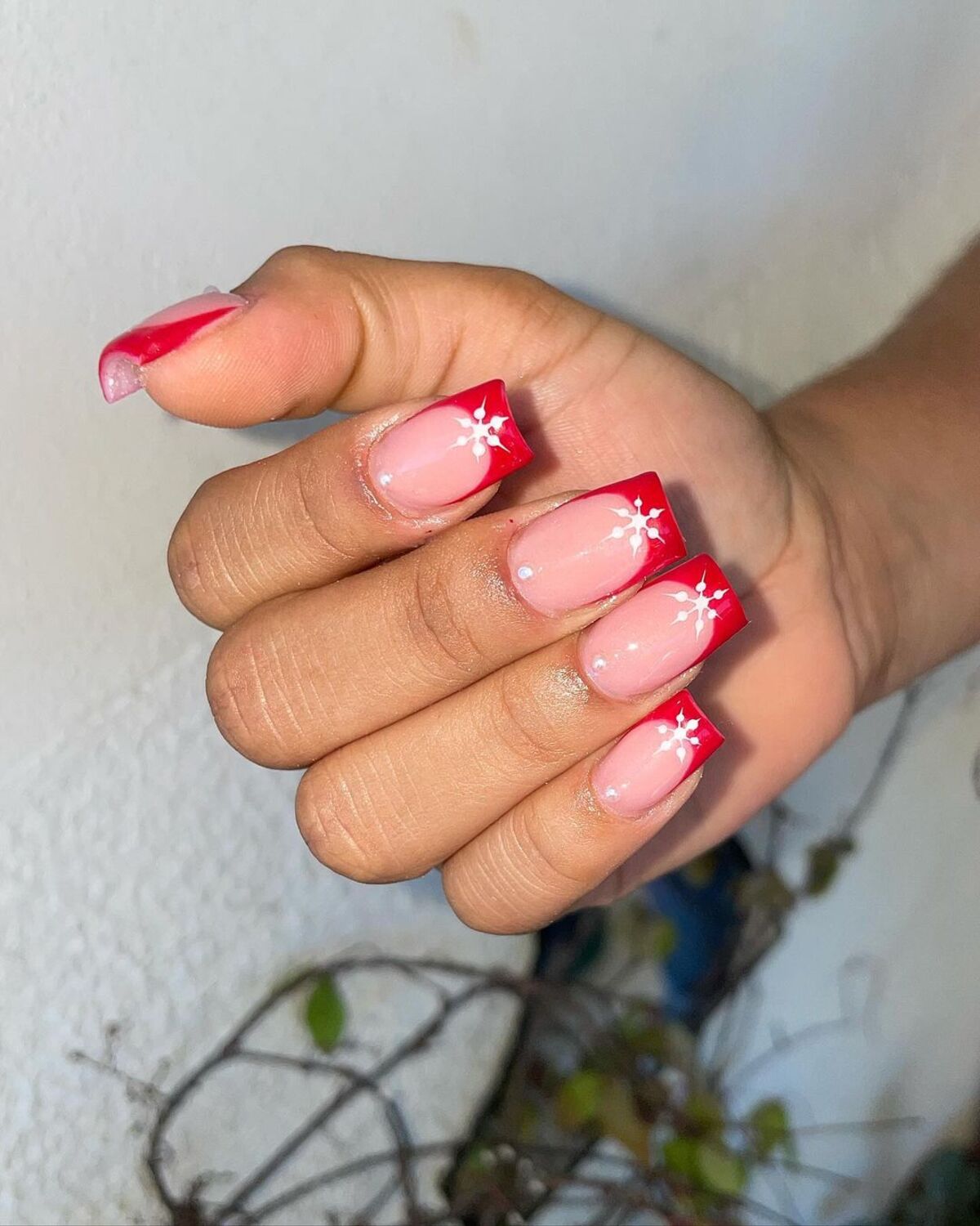 6. Red French Tips with Starry Accents