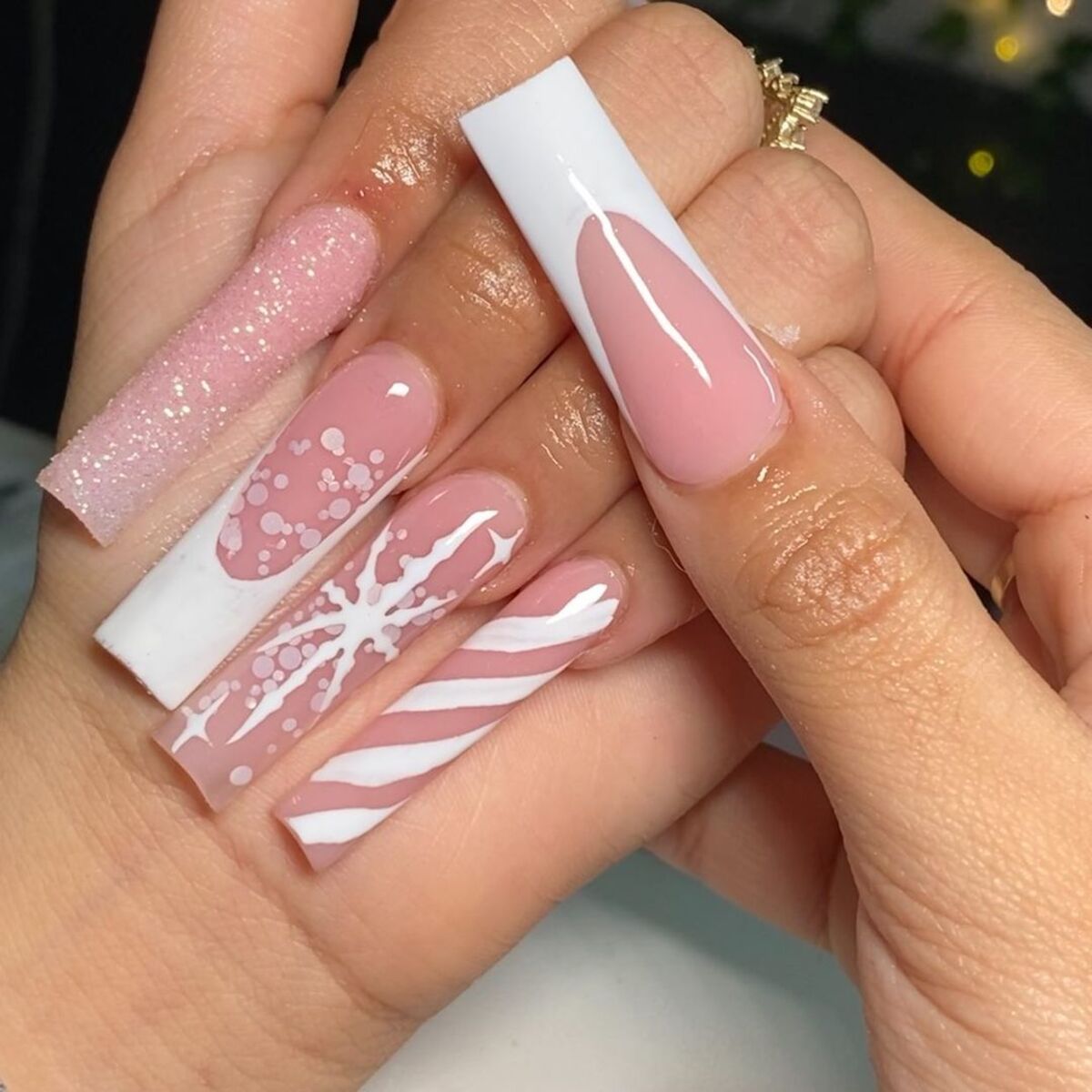 10. Minimalist Pink and White Snowflake Nails