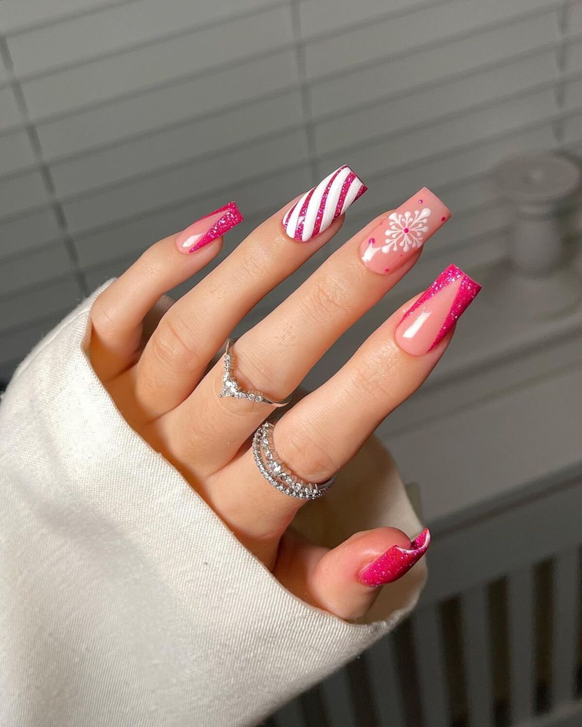 11. Candy Cane-Inspired Pink and White Glitter Nails