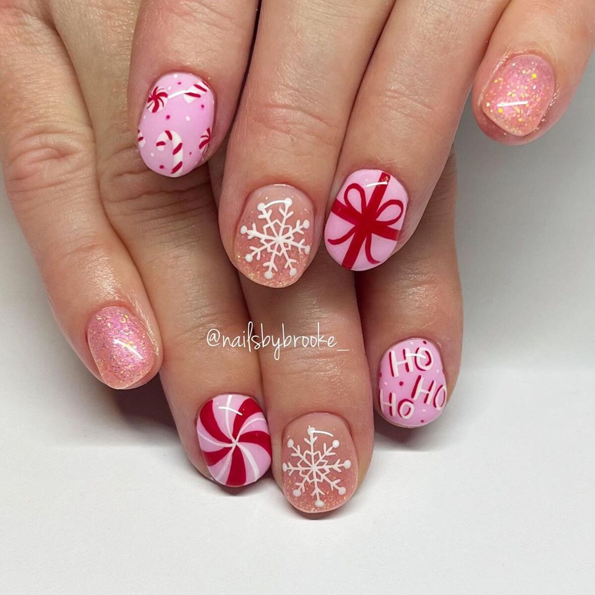 12. Cute Holiday Peppermint and Gift-Themed Nails