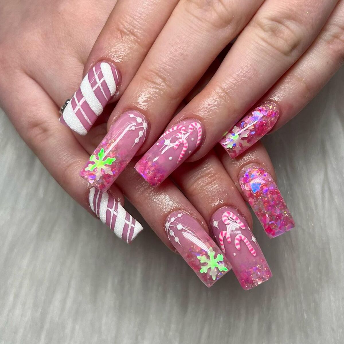 15. Festive Pink and White Candy Cane Nails