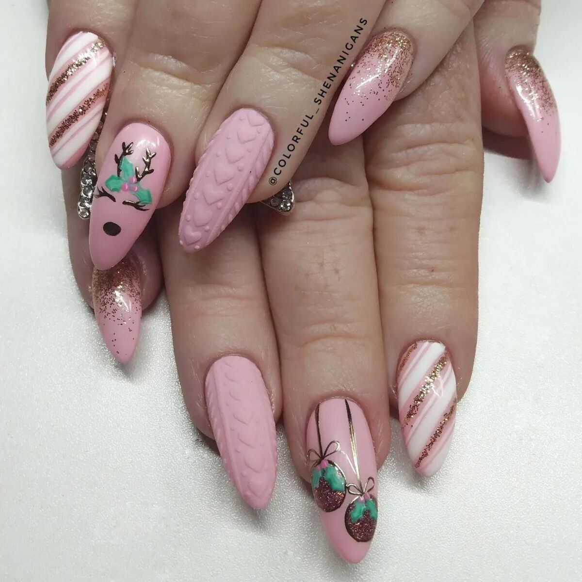 17. Pink Knit Sweater and Reindeer Holiday Nails