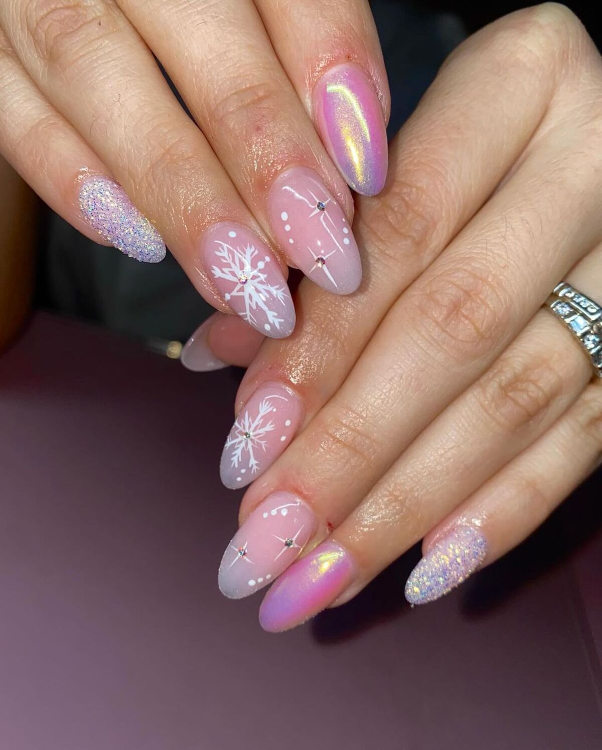 19. Subtle Pink Snowflake Glitter Nails