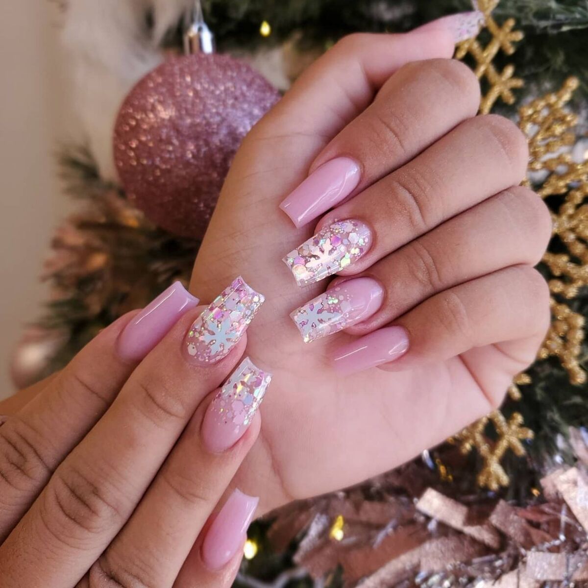 24. Pink Glittery Confetti Holiday Nails