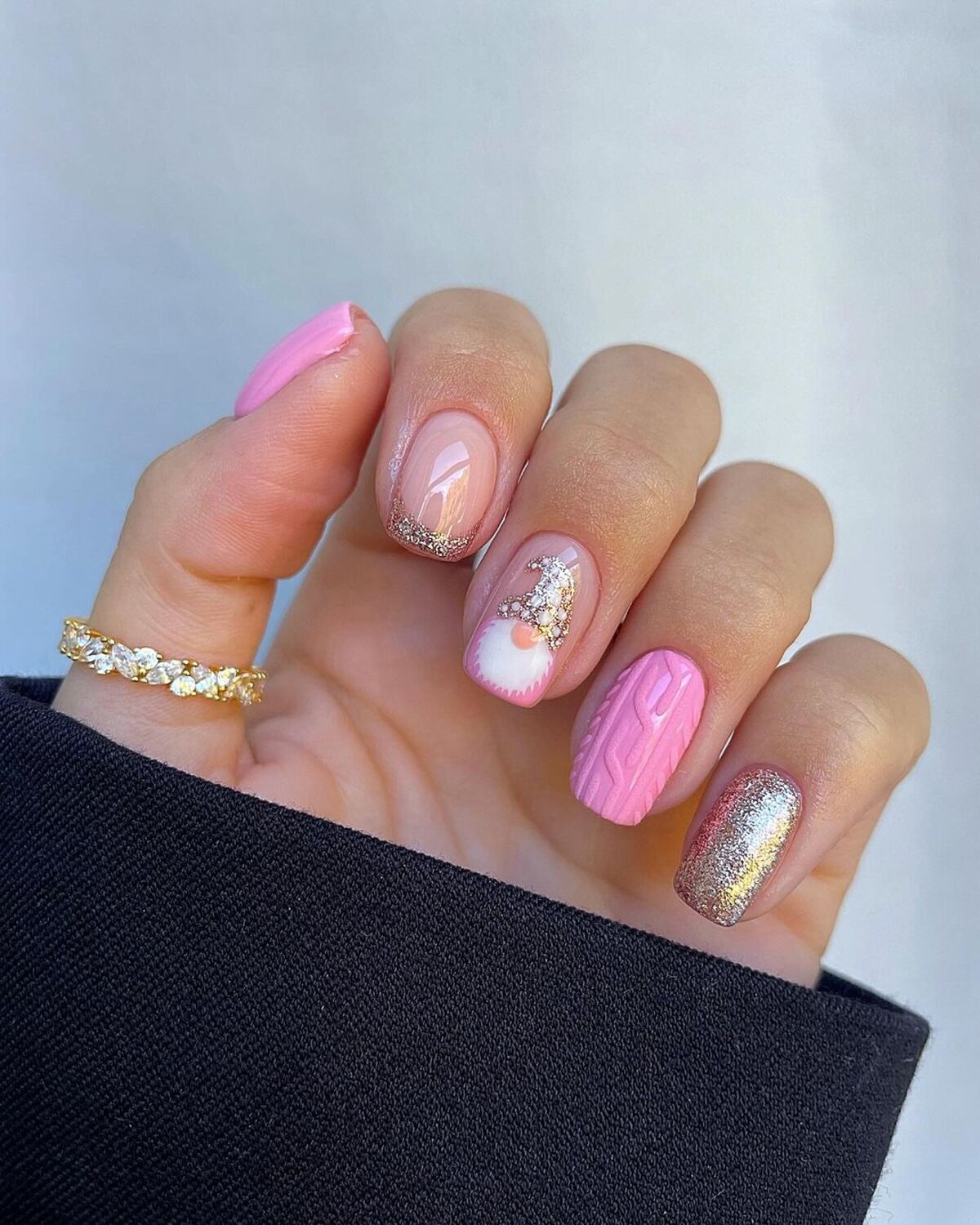 29. Pink and Gold Sparkly Holiday Nails