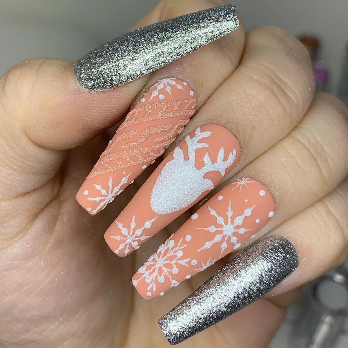 18. Frosty Silver and Peach Snowflake Design