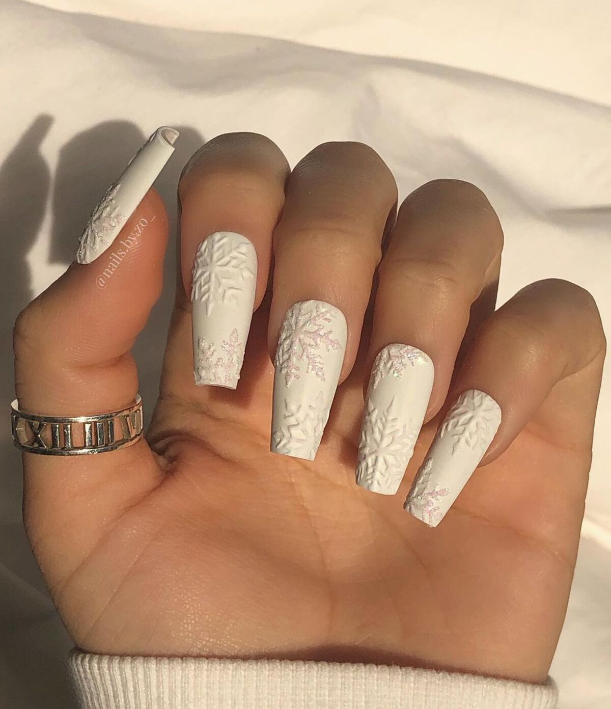 7. Textured White Snowflake Nails