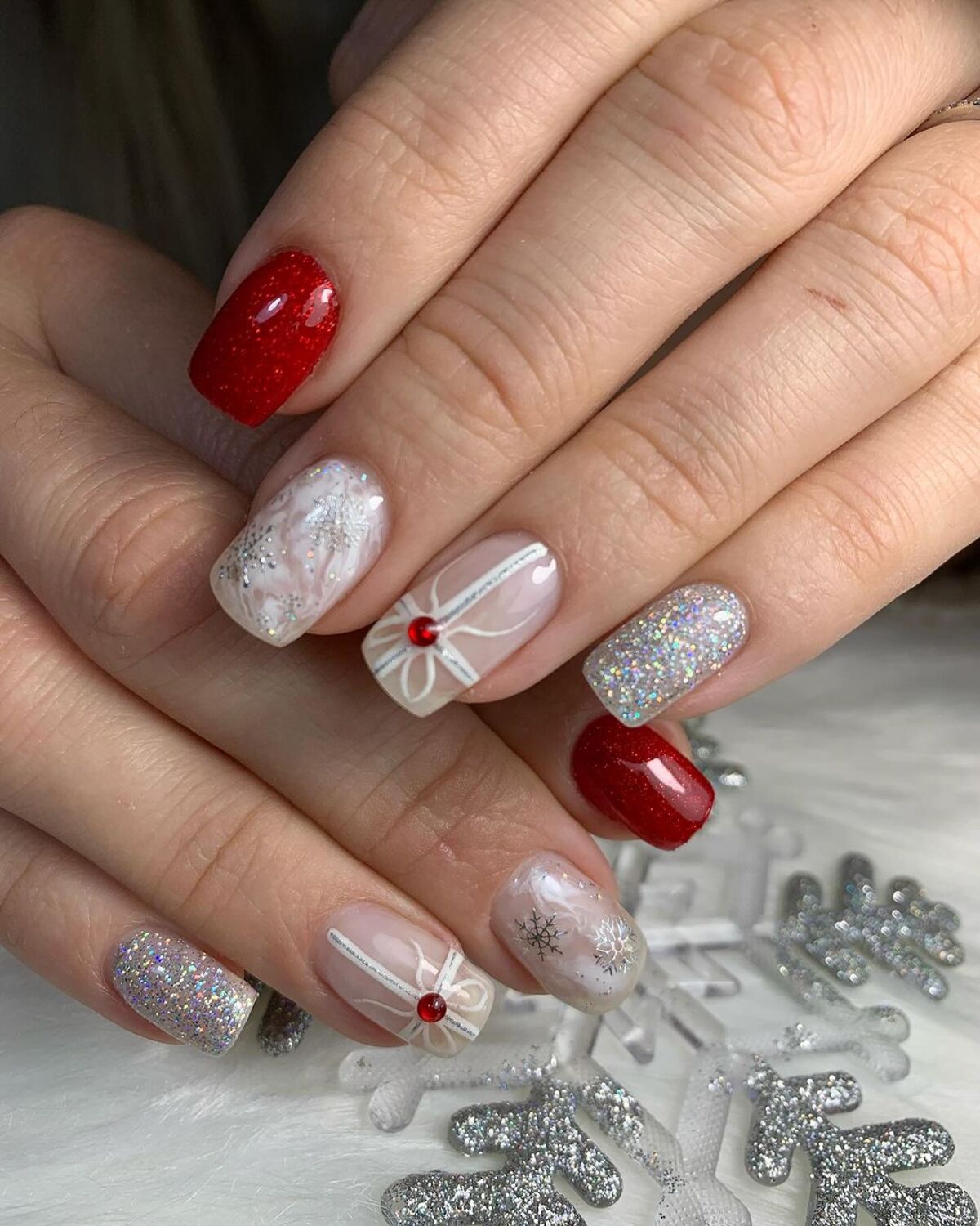 18. Red and Glittery Gift-Wrapped Nails