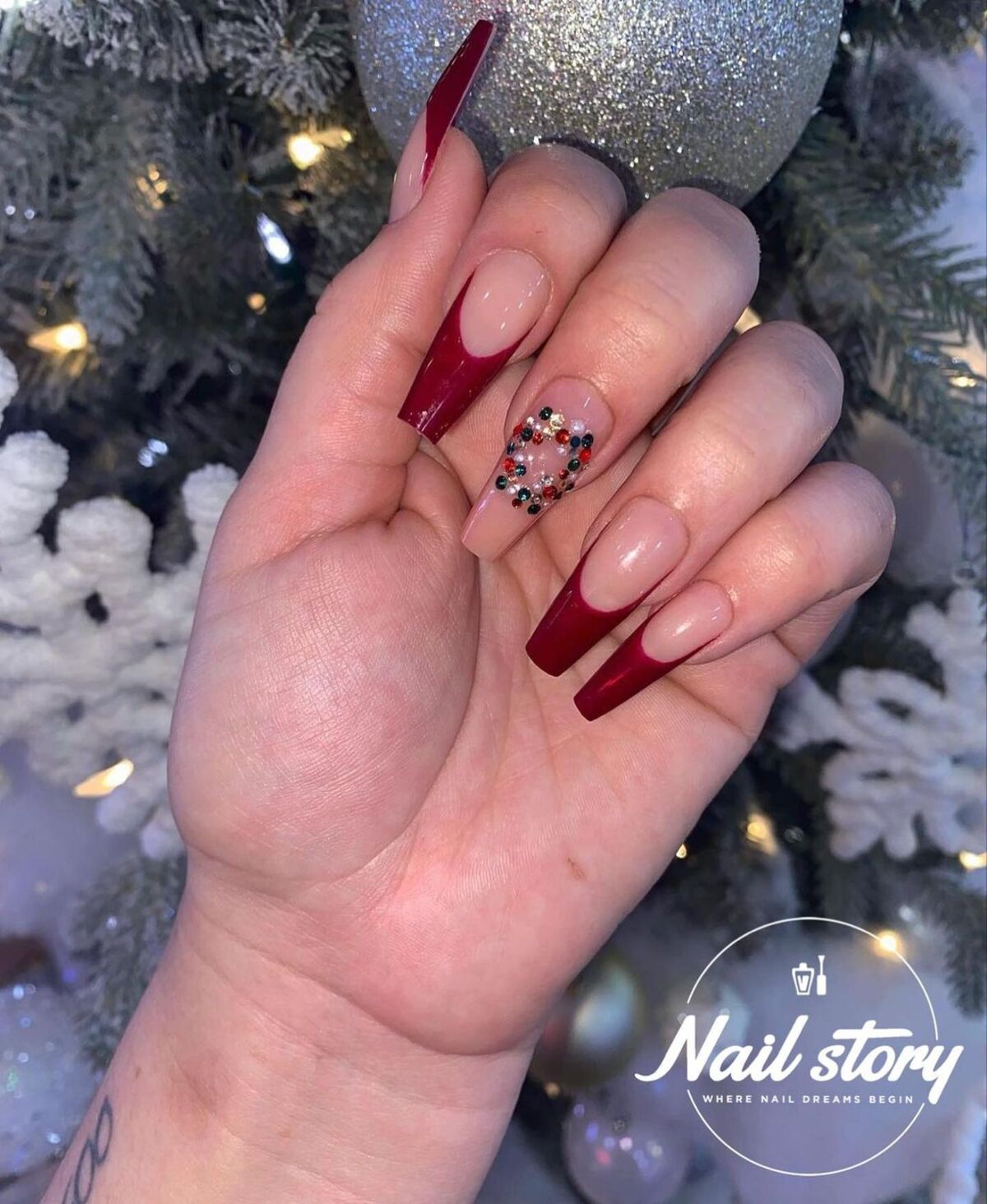 21. Burgundy French Tips with Festive Jewels