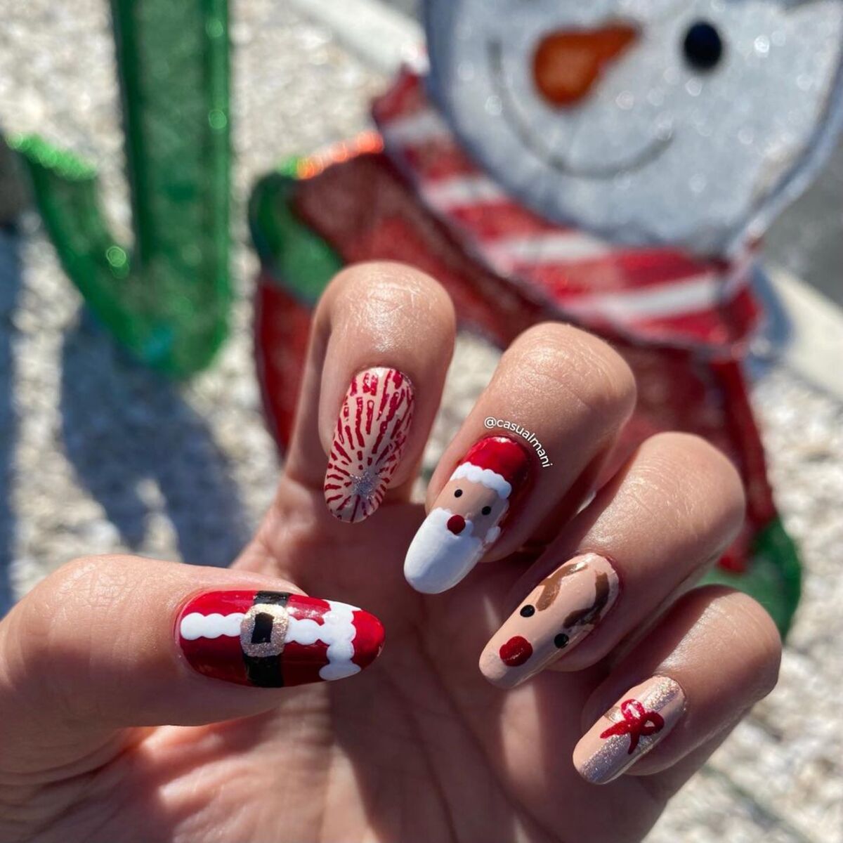 19. Peppermint Swirl and Santa Belt Nail Art