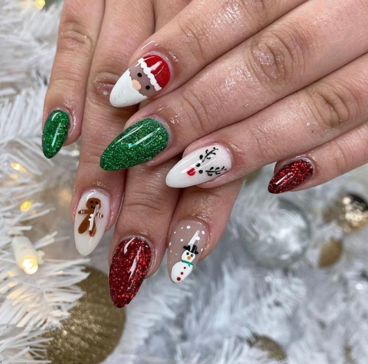 20. Glittering Green and Red Christmas Nails with Snowman and Gingerbread