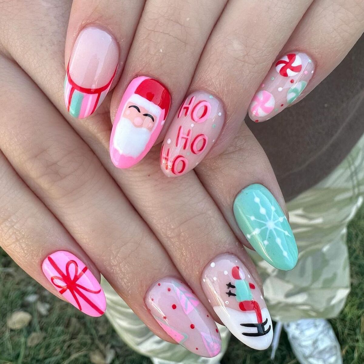 3. Whimsical Pastel Christmas Nails with Santa and Candy Accents