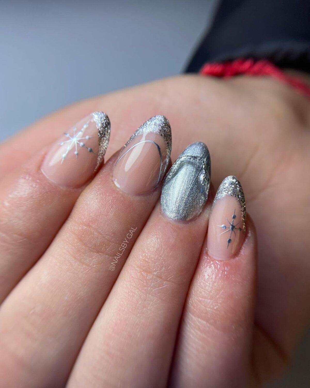 1. Frosty Silver Tips with Subtle Snowflakes