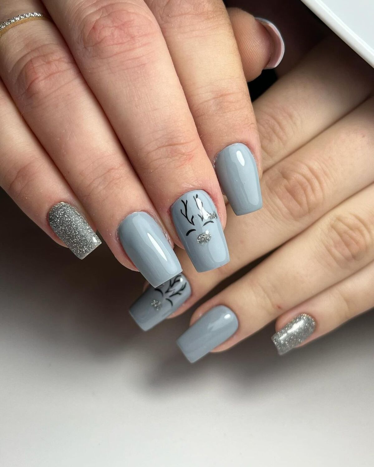 26. Frosted Reindeer Accents on Gray Nails