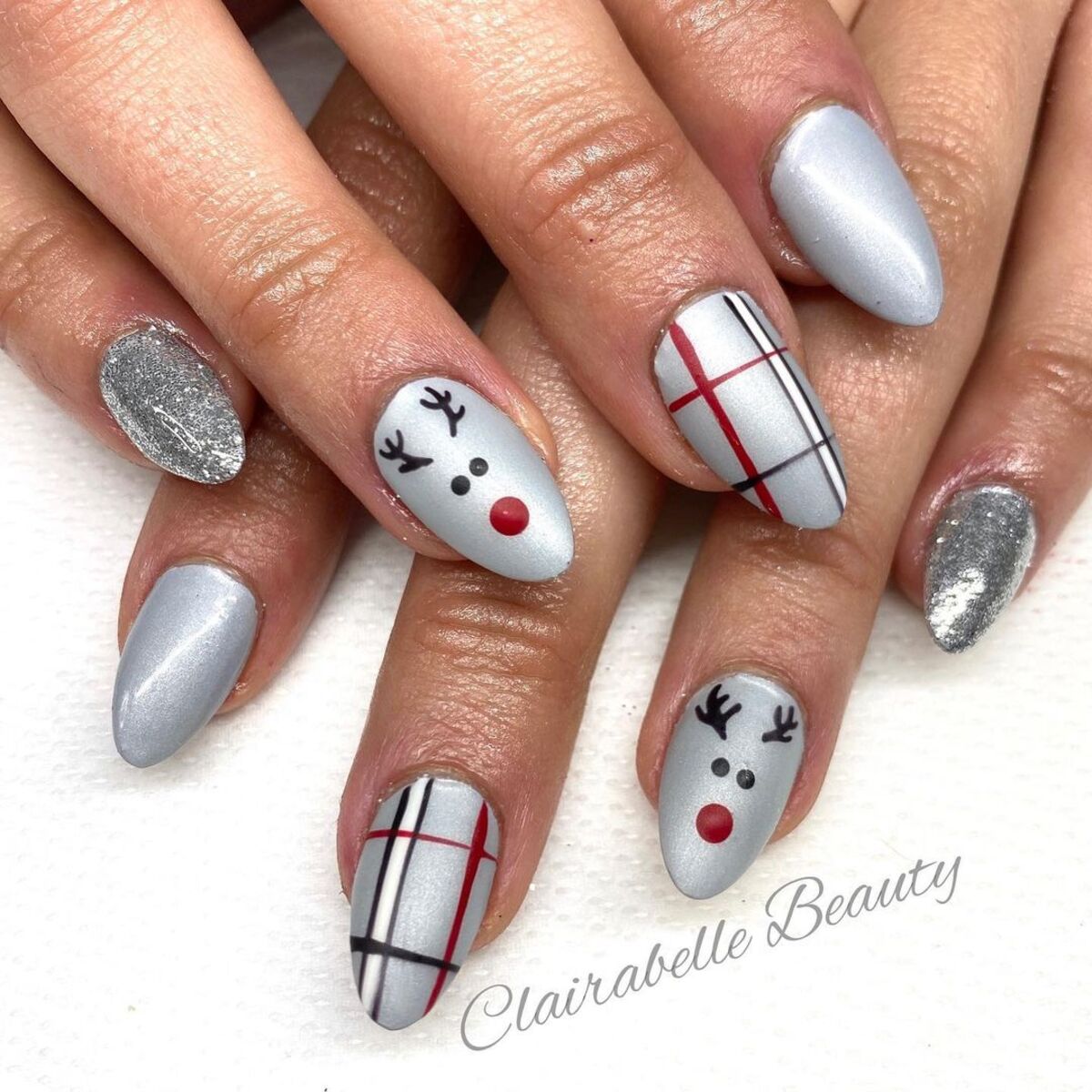 6. Cute Reindeer and Plaid Holiday Nails