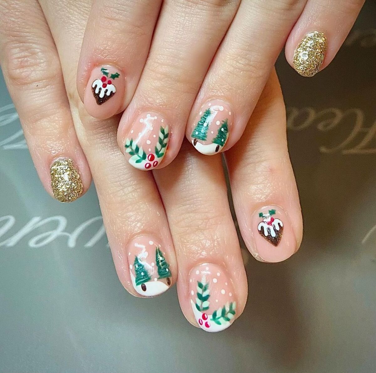 15. Festive Holly and Christmas Pudding Nail Art