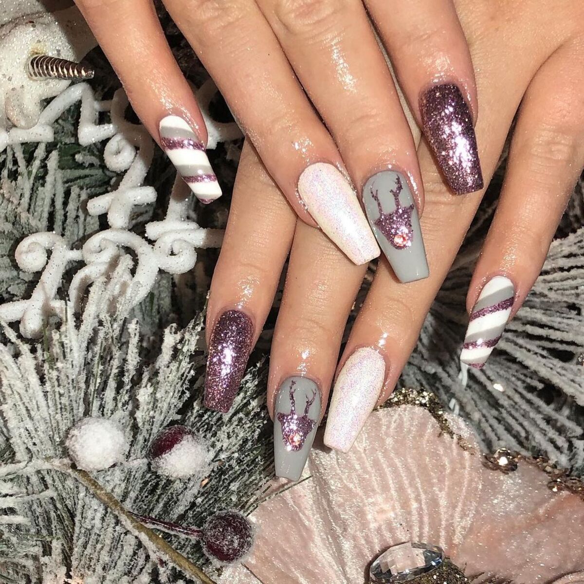 17. Silver and Lilac Glitter Reindeer Nails