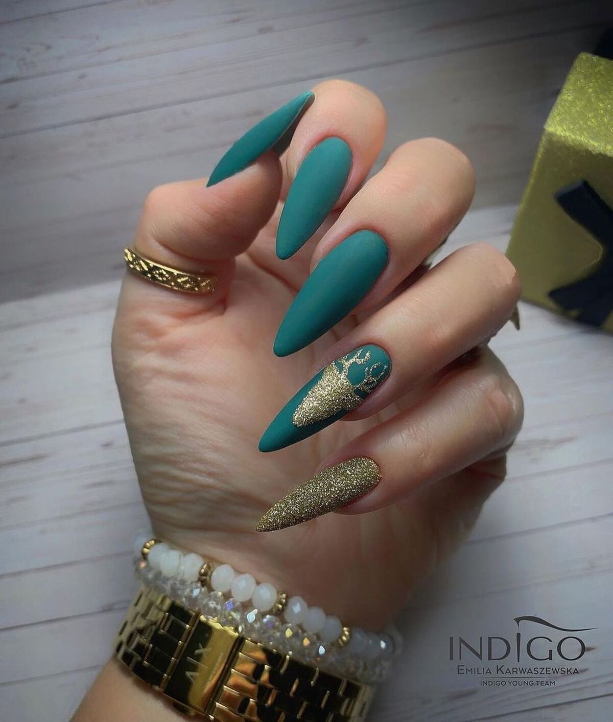 19. Teal and Gold Matte Reindeer Nails