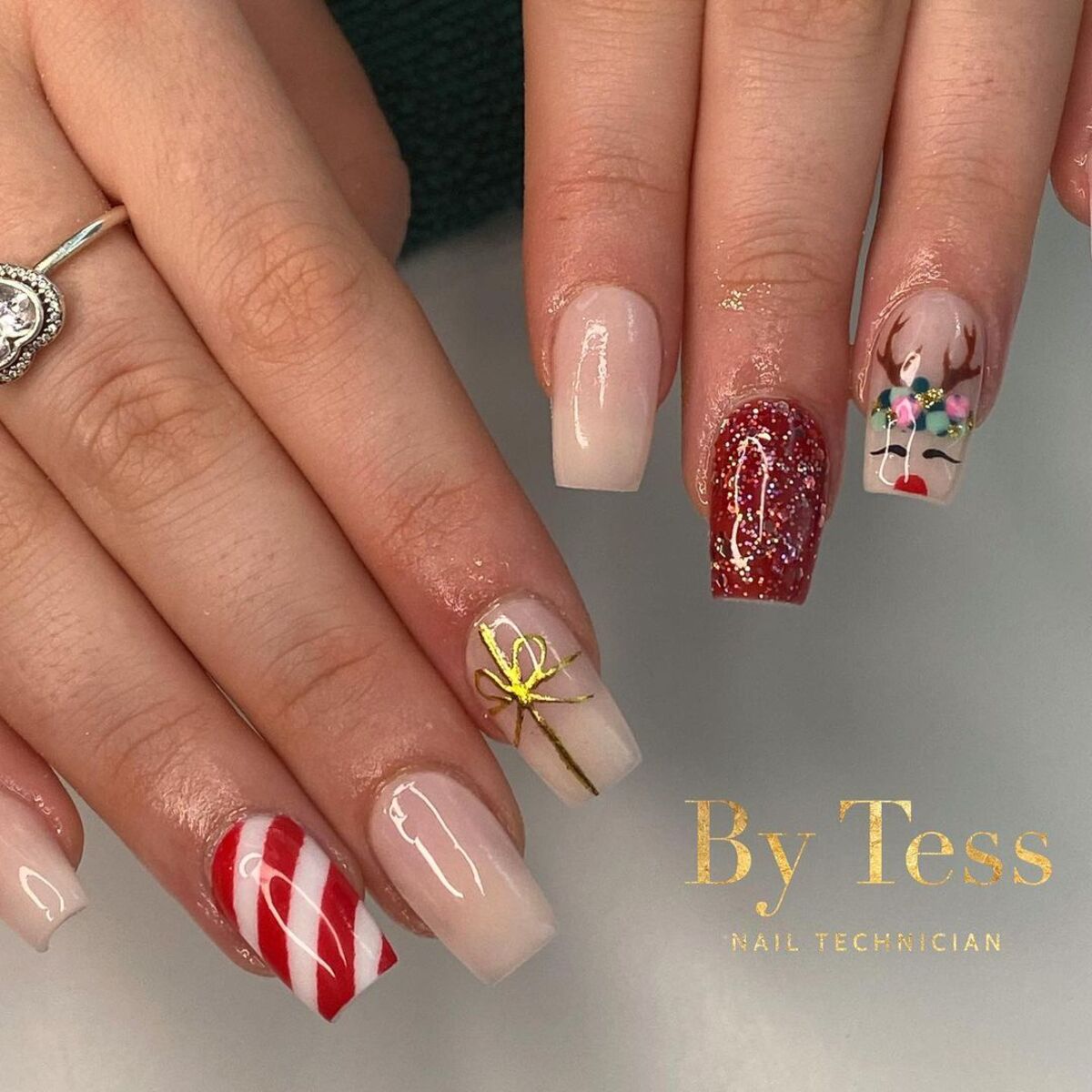 23. Festive Gift Wrap and Reindeer Nails