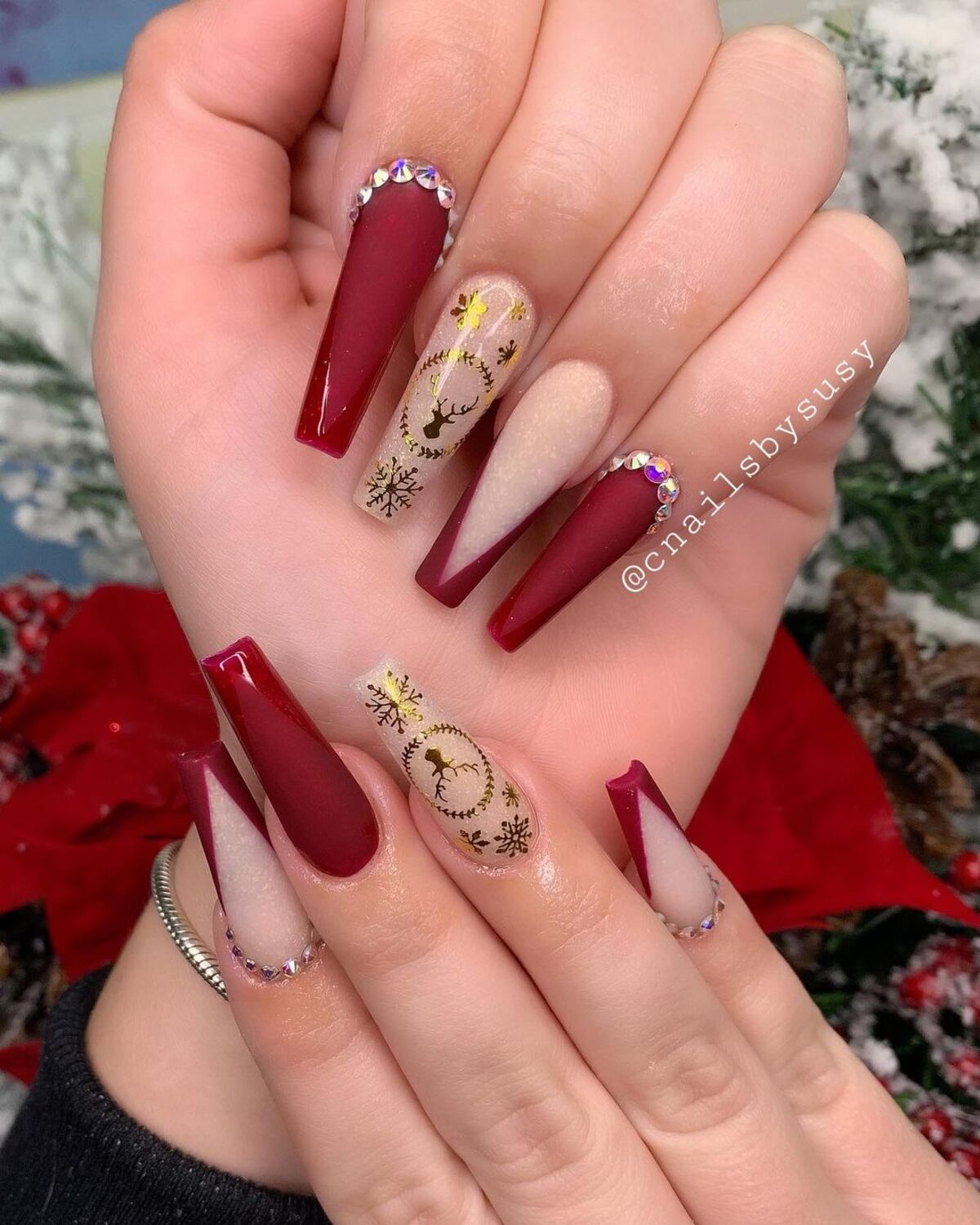 22. Glamorous Red French Tips with Gold and Rhinestones